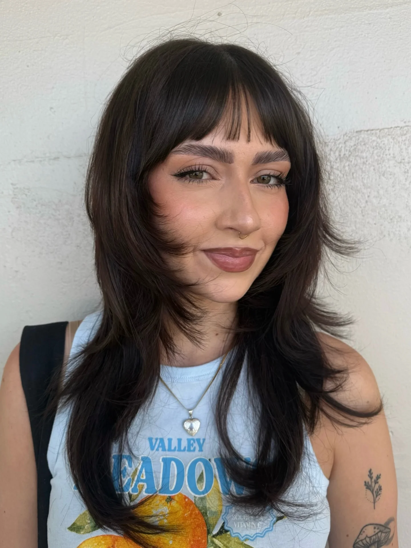 airy summer haircuts with bangs 2026 Soft Layered Shag With Feathered Bangs