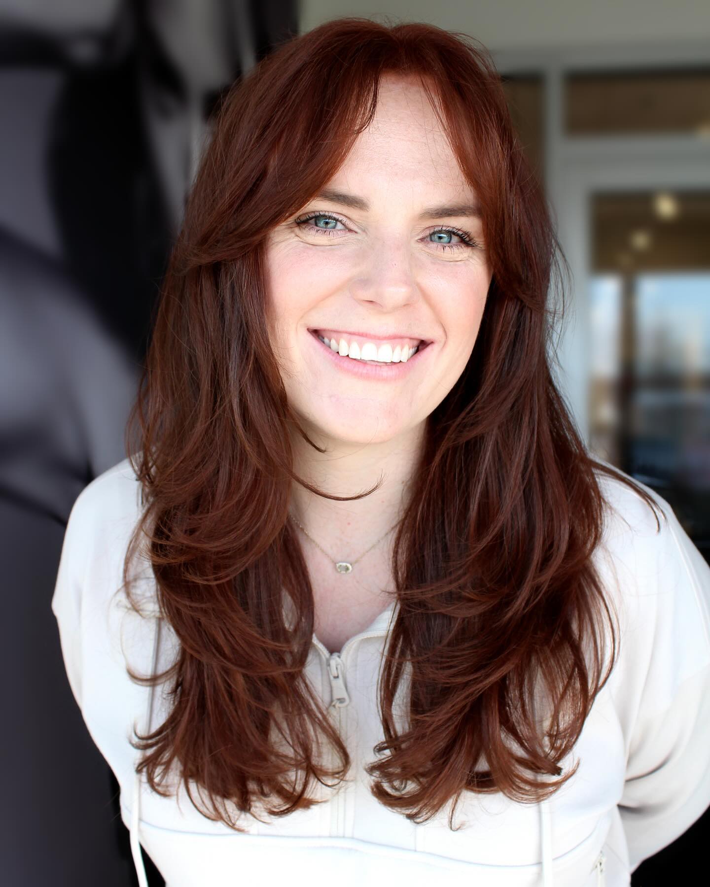 spicy summer auburn hair color 2026 Soft Layered Auburn With Airy Fringe Glow