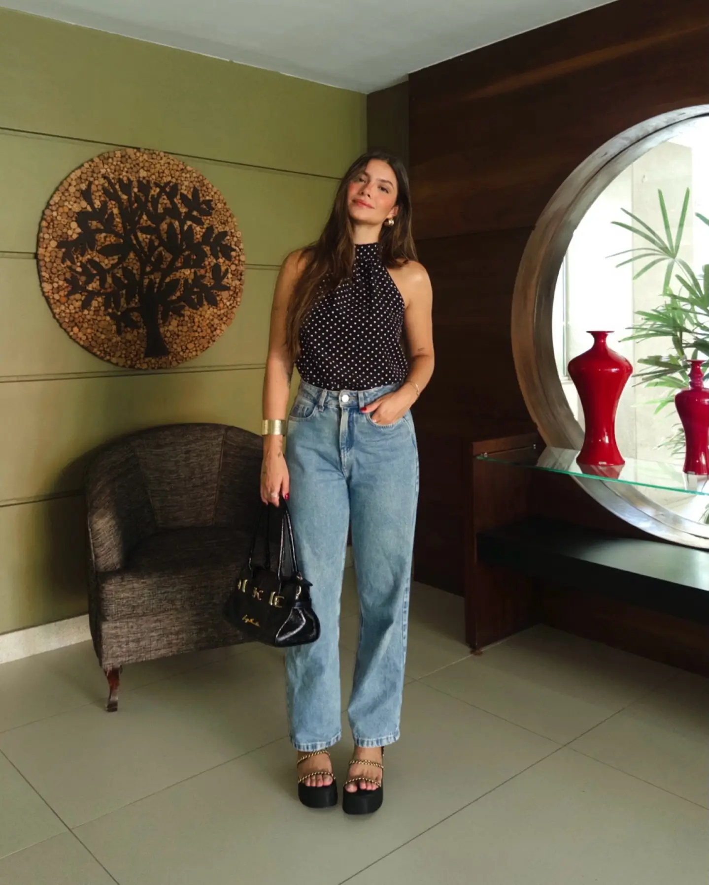 summer sleeveless tops for women 2026 Polished Ease With A Black Halter And Relaxed Denim