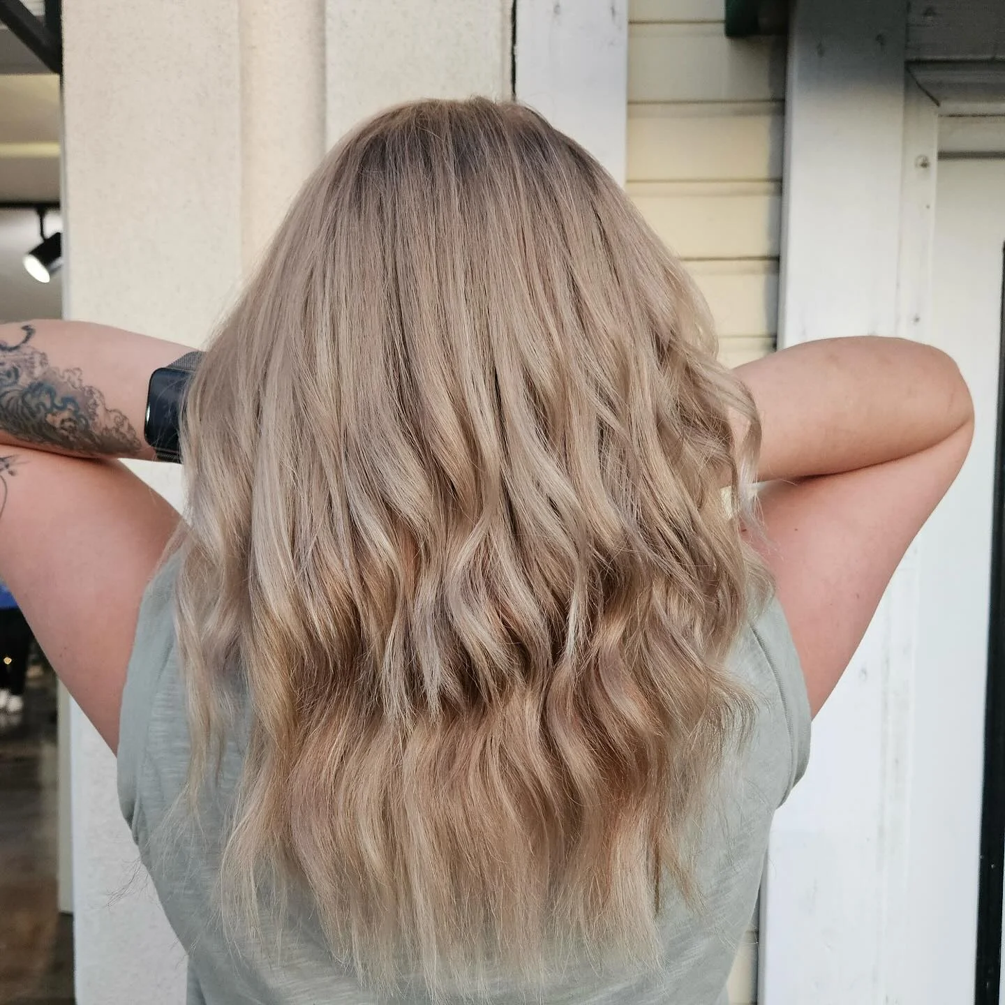 beachy summer hair color for tan skin 2026 Soft Sandy Blonde Waves With Sunlit Dimension