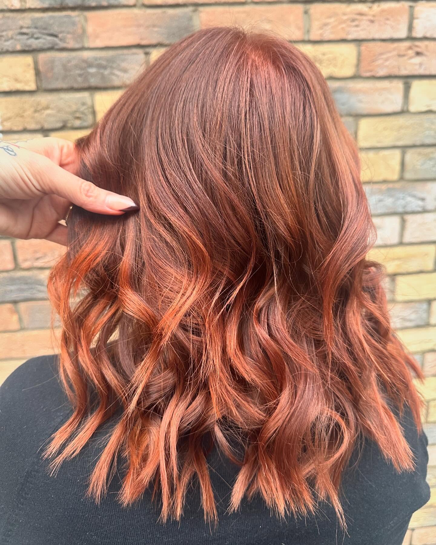 spicy summer auburn hair color 2026 Textured Copper Auburn Waves With Playful Contrast