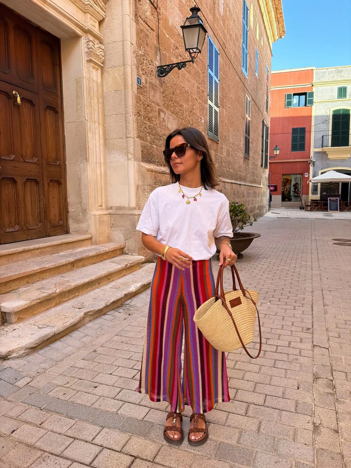 summer clothes for women 2026 Colorful Striped Pants And White Tee Playful Summer Balance