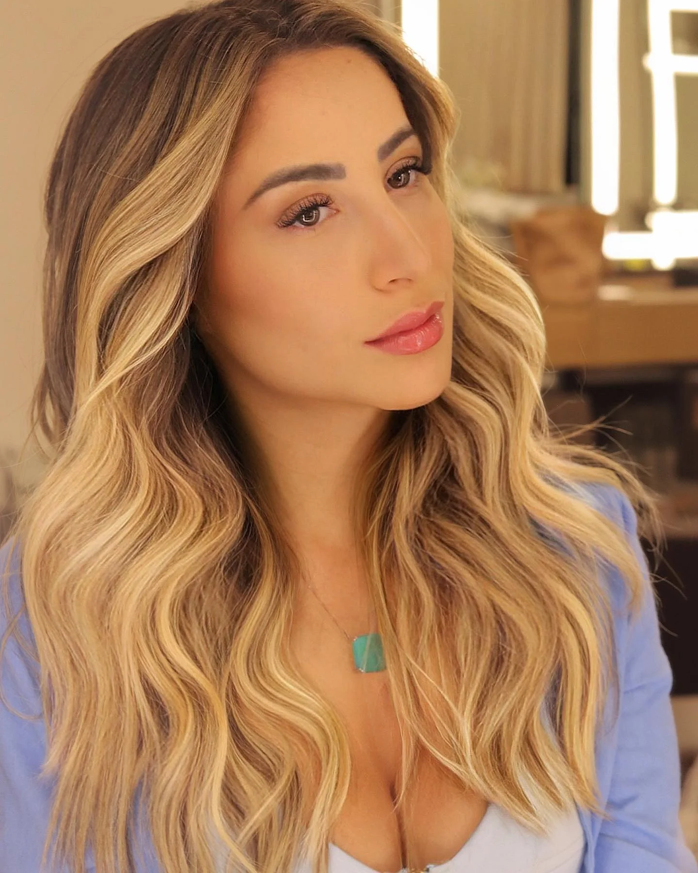 beachy summer hair color for tan skin 2026 Golden Face Framing Blonde With Soft Glam Waves
