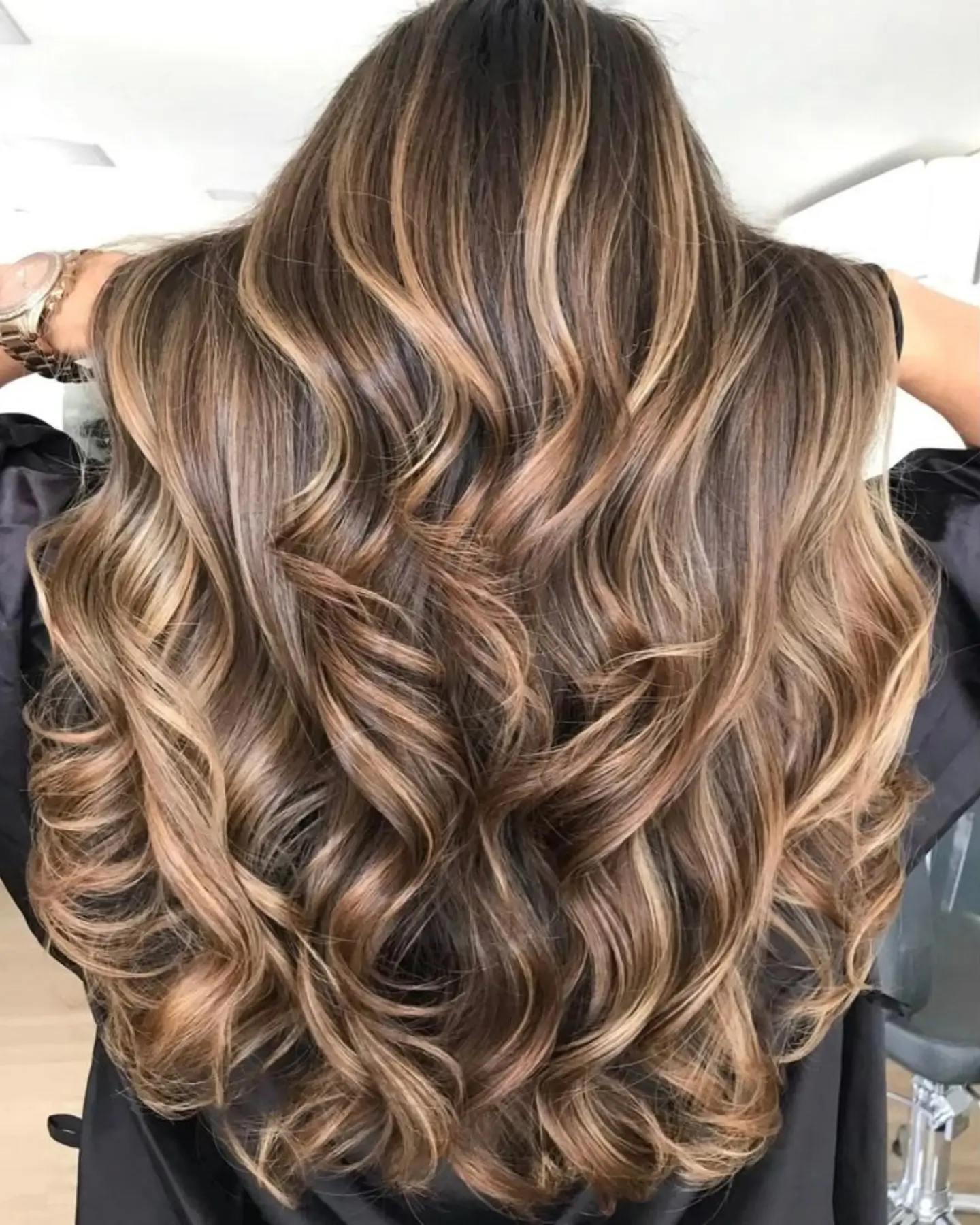 summer hair color ideas 2026 Caramel Ribbon Brunette With Voluminous Waves