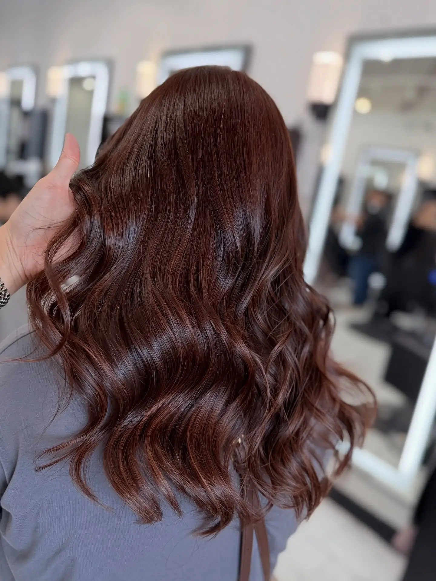summer hair color ideas 2026 Rich Auburn Gloss With Soft Defined Waves