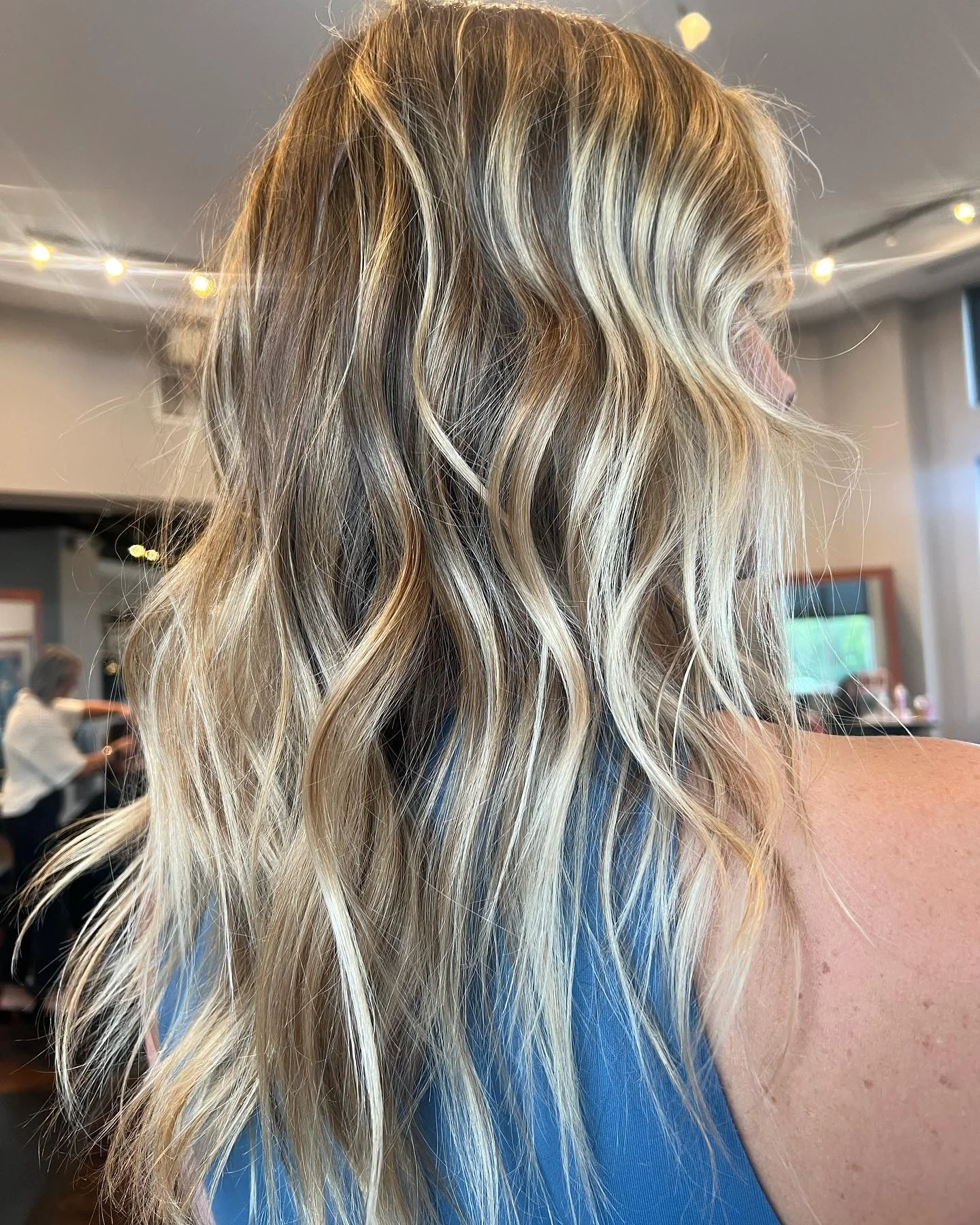 beachy summer hair color for tan skin 2026 High Contrast Beach Blonde With Textured Layers