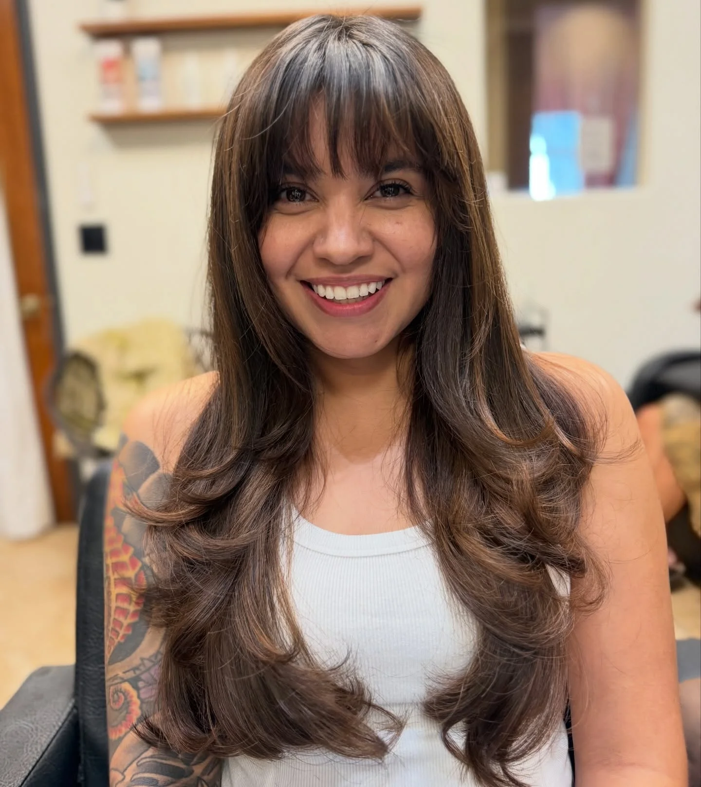 airy-summer-haircuts-with-bangs-2026 Glossy Long Layered Cut With Soft Airy Bangs