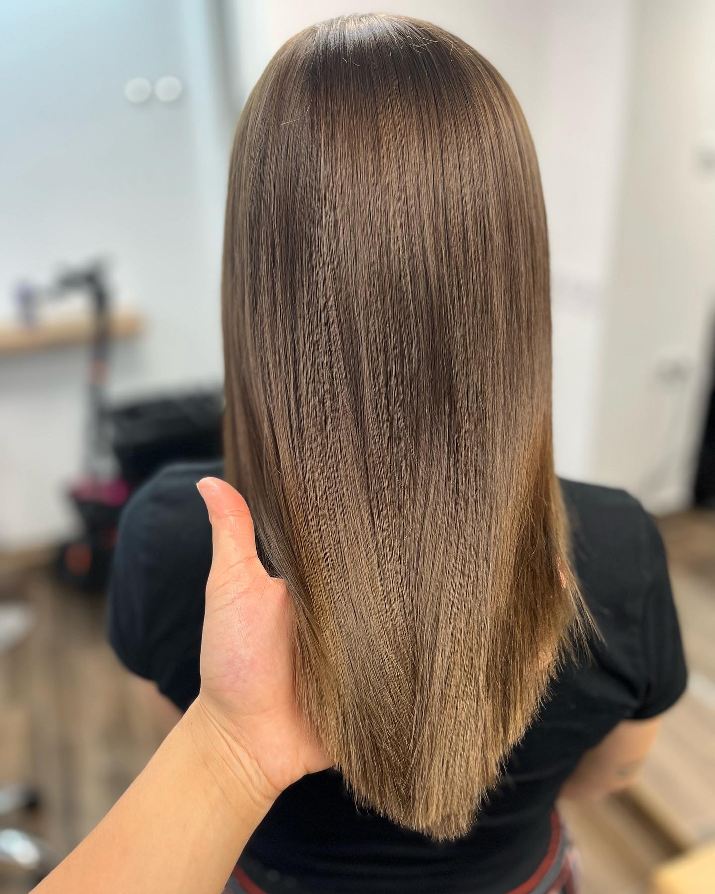 light summer hair color brunette Sleek Glassy Brunette With Soft Neutral Shine