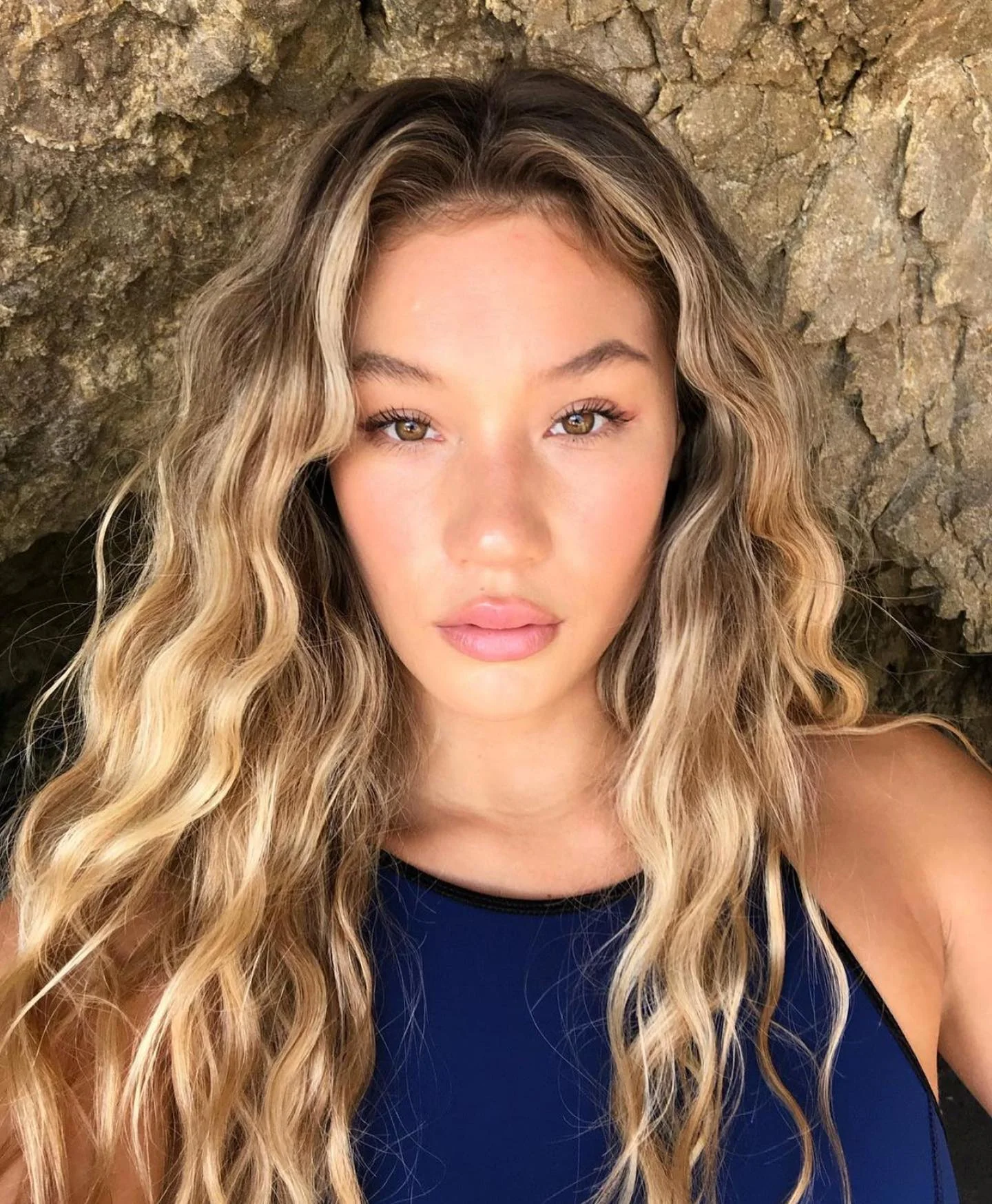 beachy summer hair color for tan skin 2026 Beachy Root Melt With Face Framing Blonde Waves