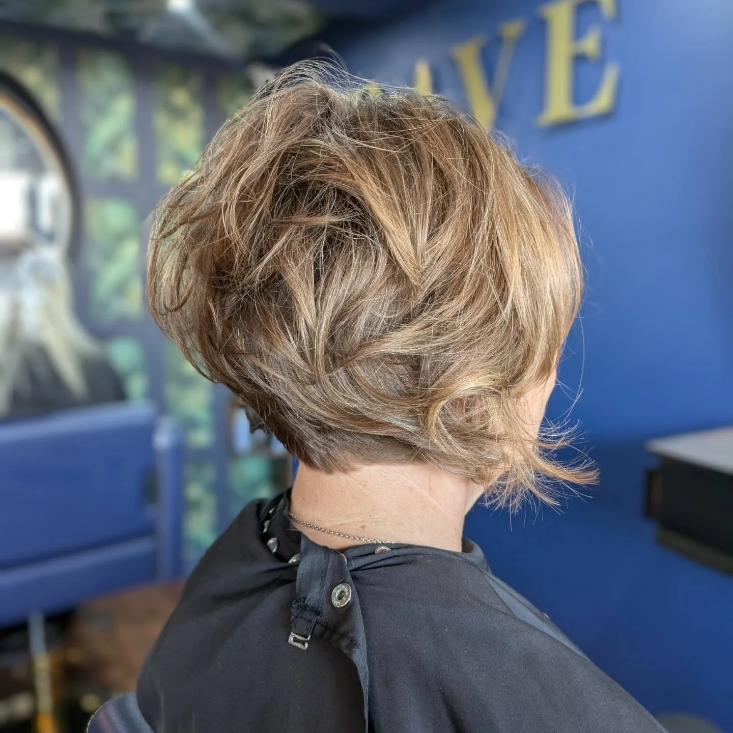 cropped summer bixie haircut 2026 Feathered Blonde Bixie With Lifted Crown Volume