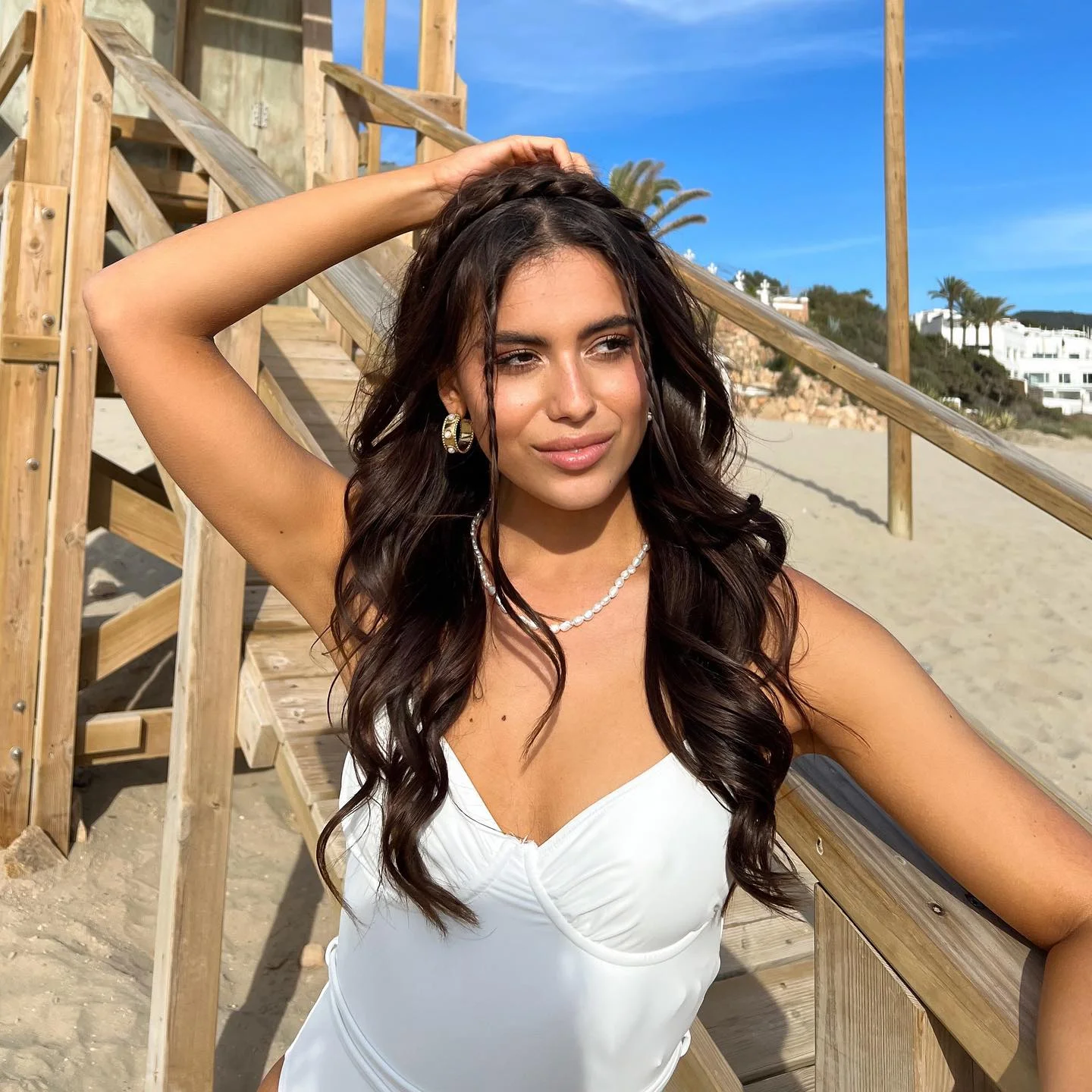 beachy summer hair color for tan skin 2026 Rich Espresso Waves With Glossy Sunlit Finish