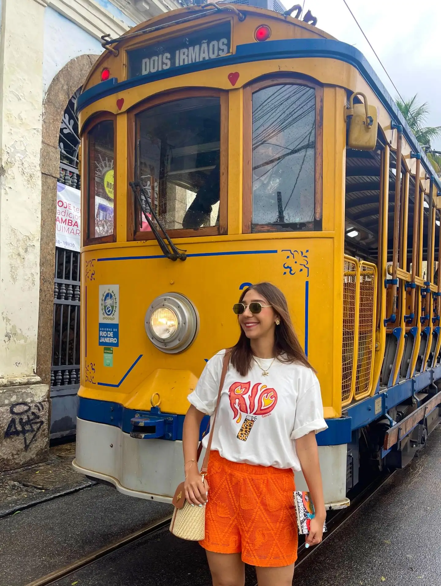 casual summer t-shirt outfit for women 2026 White Tee And Bright Orange Shorts With Vacation Mood