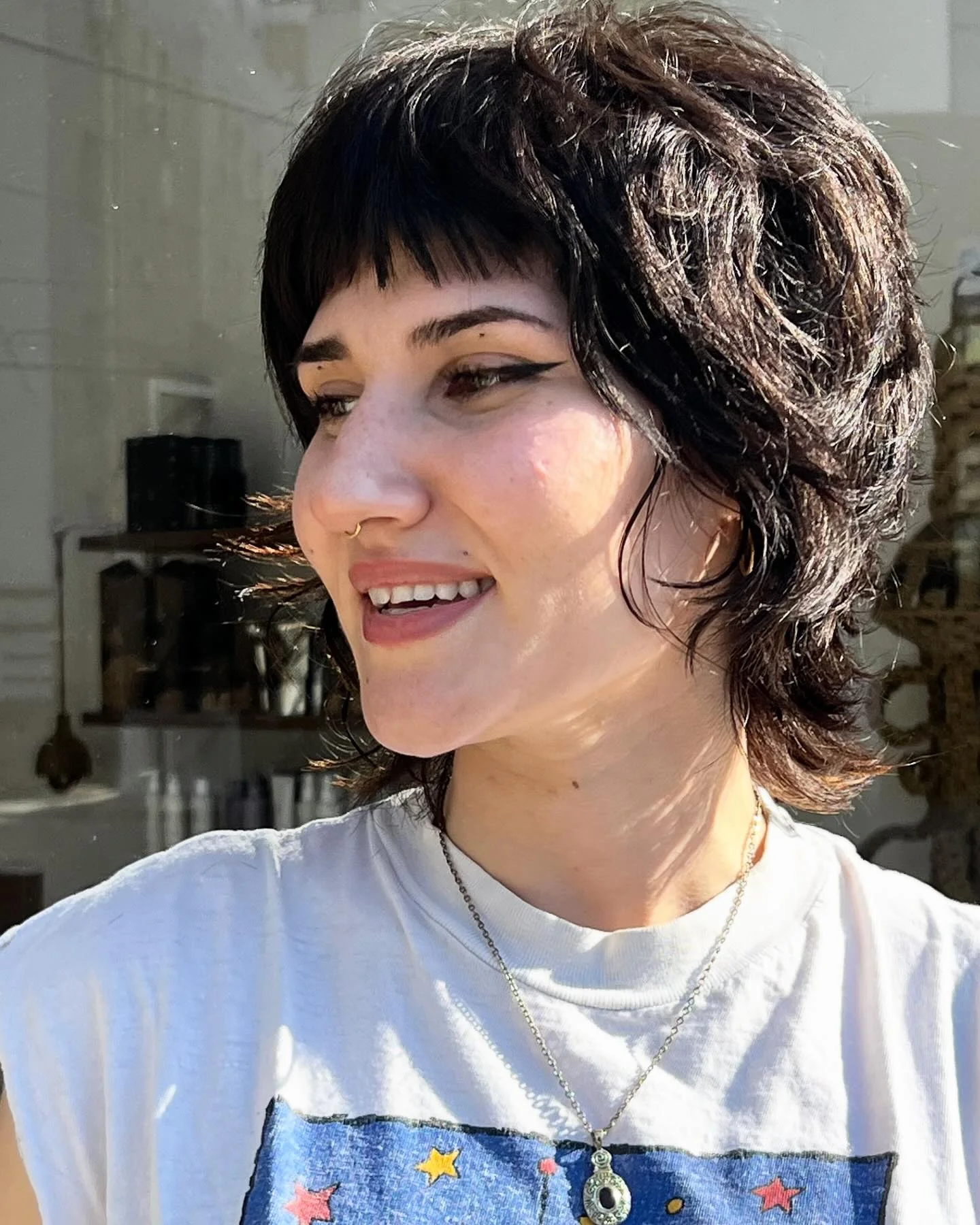cropped summer bixie haircut 2026 Edgy Micro Bangs Bixie With Dark Glossy Texture