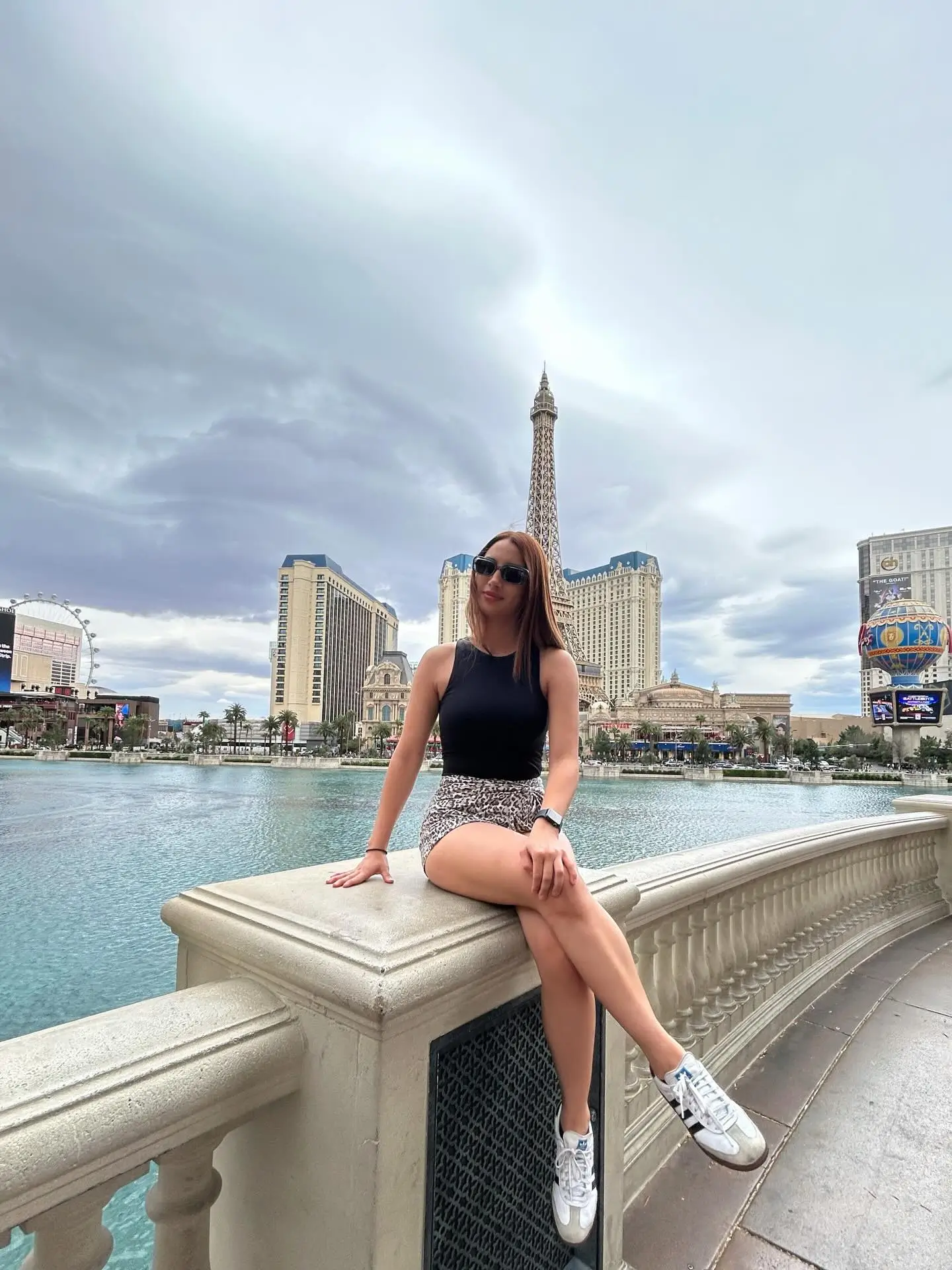 summer sleeveless tops for women 2026 Sleek Black Top And Statement Mini For A Modern City Edge