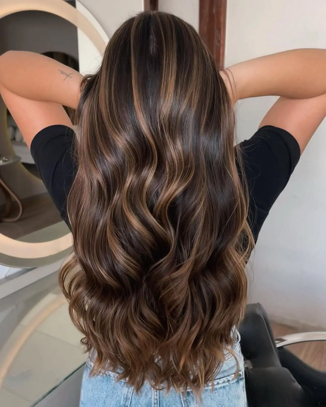 dark-rooted summer hair color for brunettes 2026 Sunlit Brunette Balayage With Caramel Ribbons