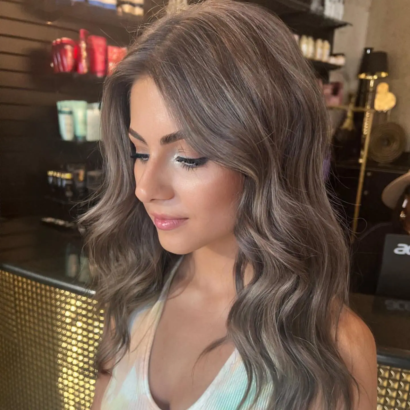 smoky summer mushroom brown hair color 2026 Cool Toned Glossy Brunette With Face Framing Light