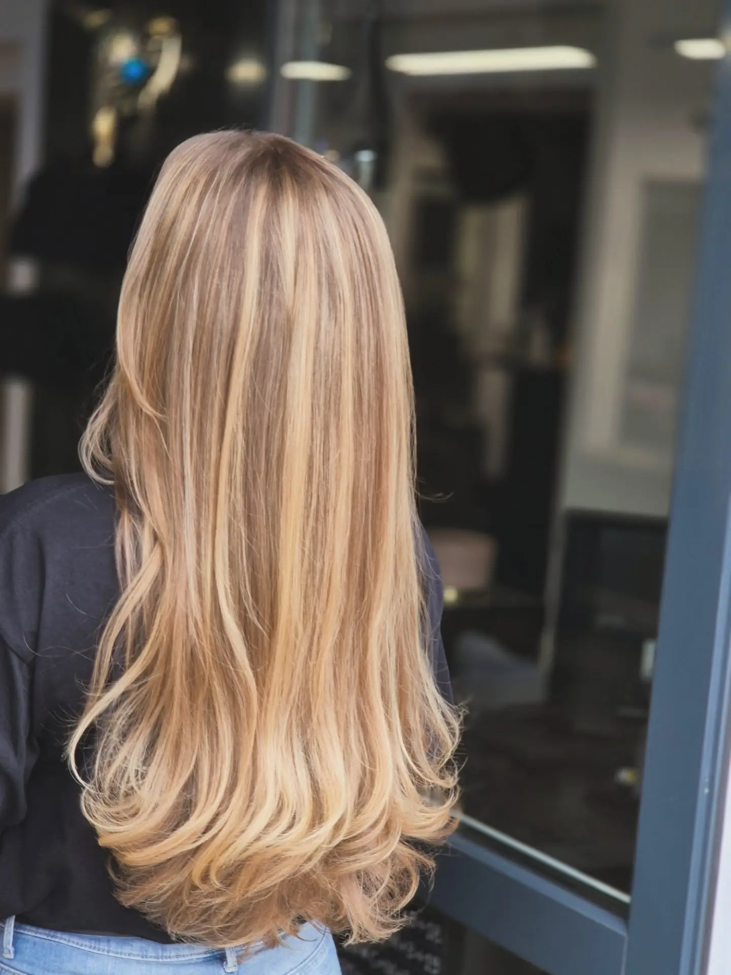 summer blonde hair color 2026 Light Reflective Champagne Blonde With Soft Curled Ends