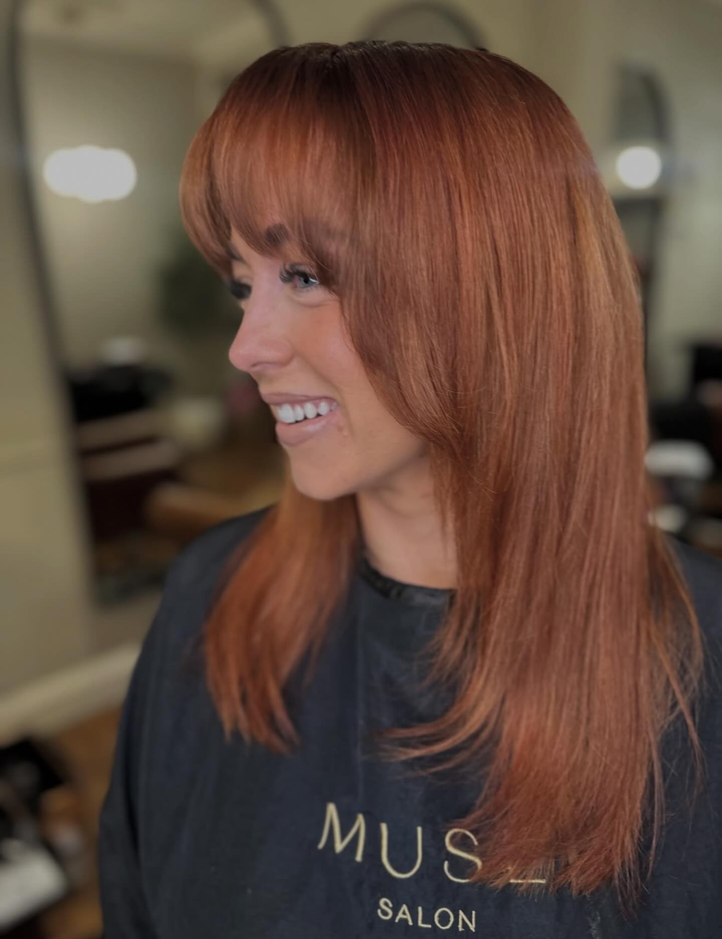 spicy summer auburn hair color 2026 Sleek Copper Auburn With Full Soft Bangs