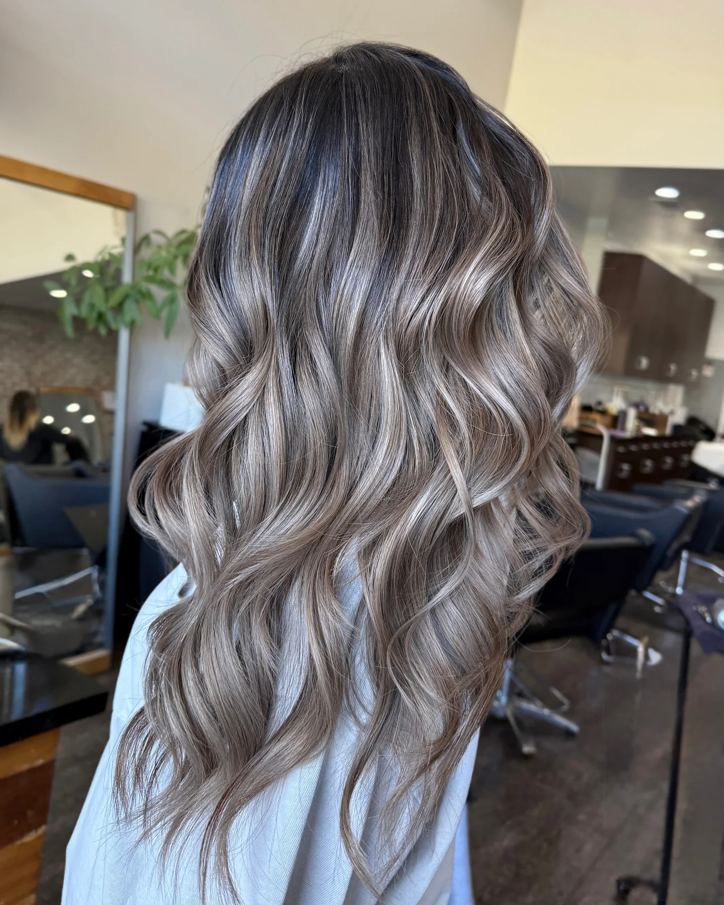 bright summer ash blonde hair color 2026 Glossy Ash Blonde Balayage With Polished Waves