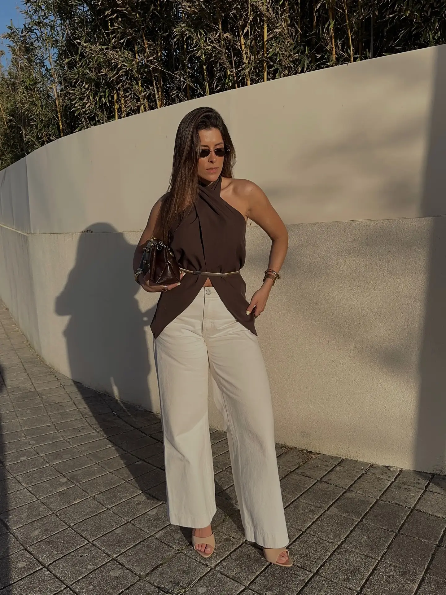 hot summer outfits 2026 Chocolate Halter And White Trousers - Clean Lines For Warm Evenings