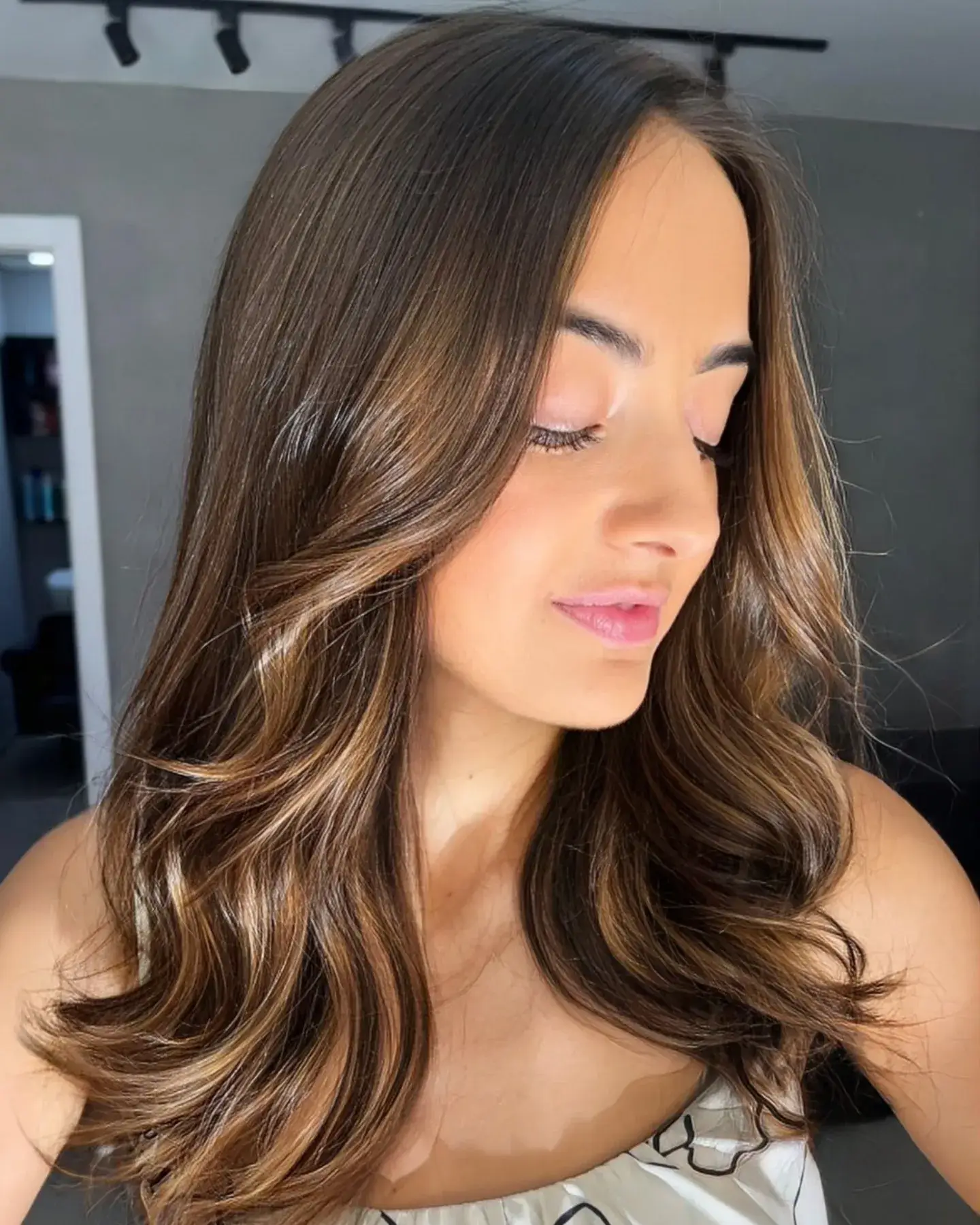 low maintenance summer ombre hair color 2026 Dimensional Chocolate Waves With Subtle Ribbon Highlights