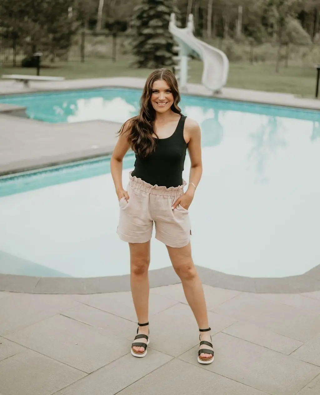 summer bodysuit outfits for women 2026 Relaxed Poolside Comfort With A Classic Black Bodysuit And Shorts