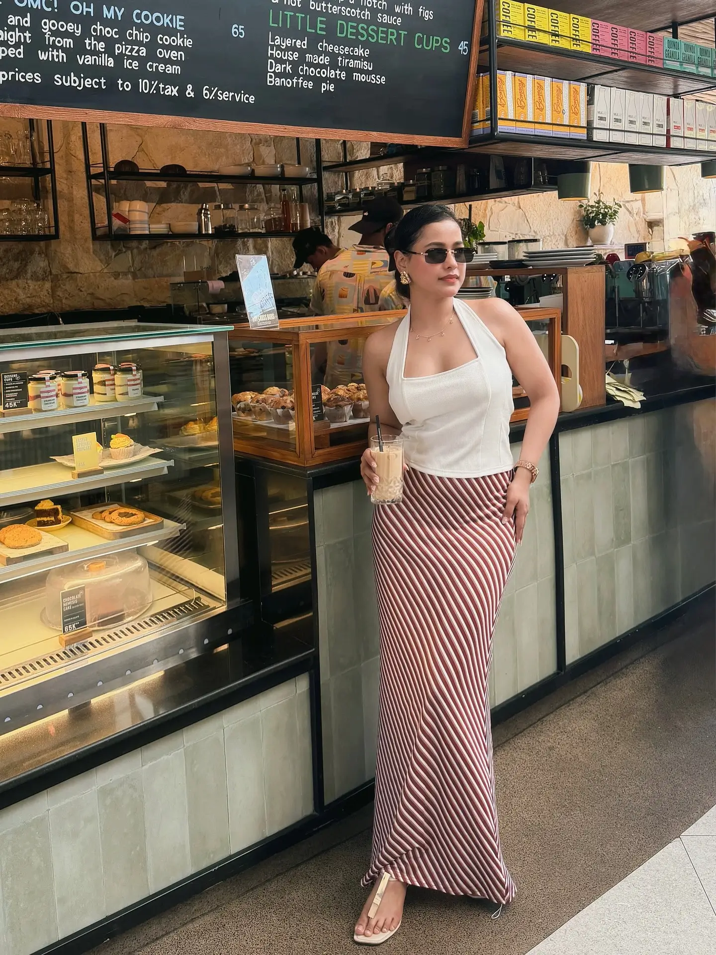 summer sleeveless tops for women 2026 City Coffee Run In A Sleek Halter And Striped Skirt