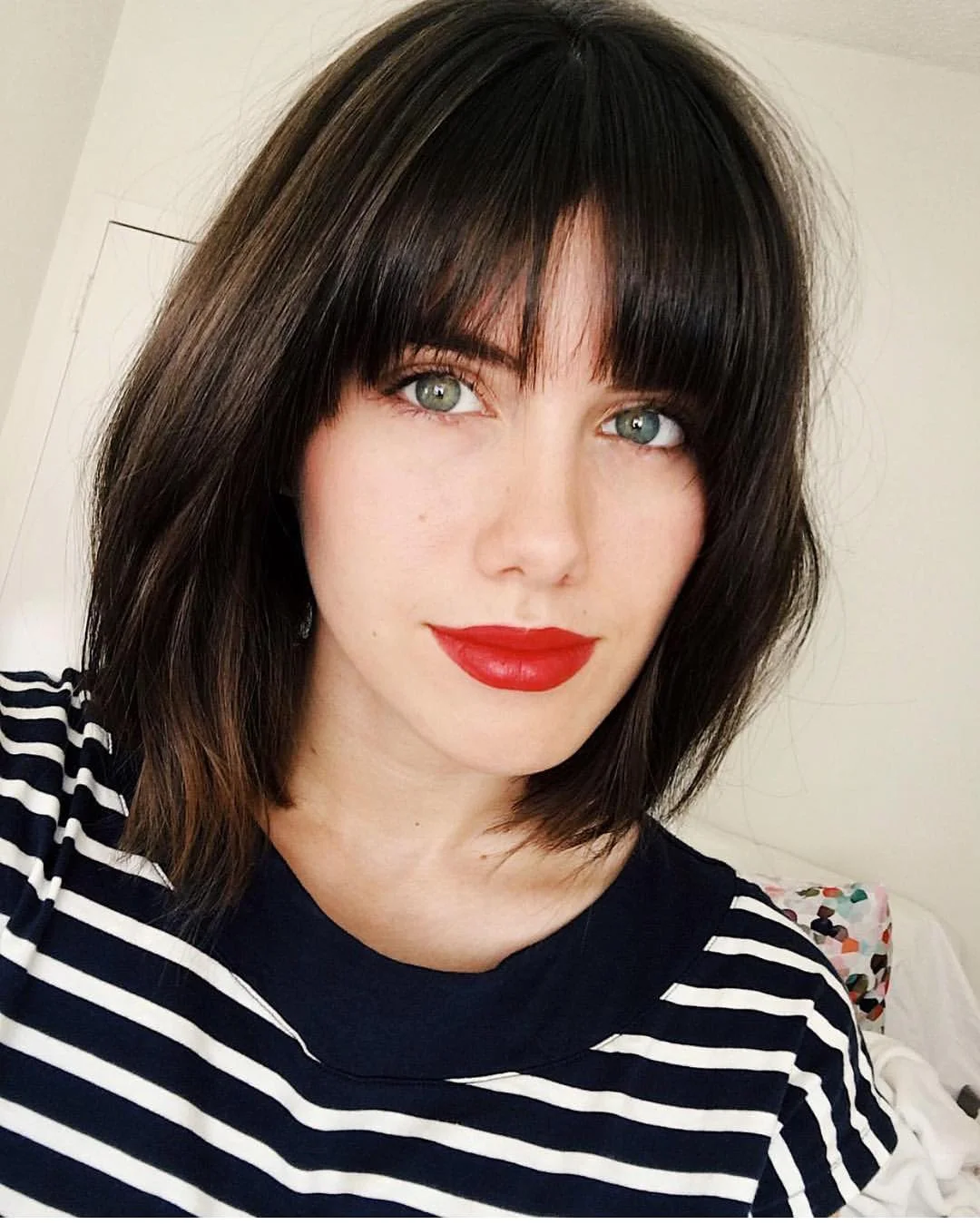airy summer haircuts with bangs 2026 Chic Short Bob With Full Fringe