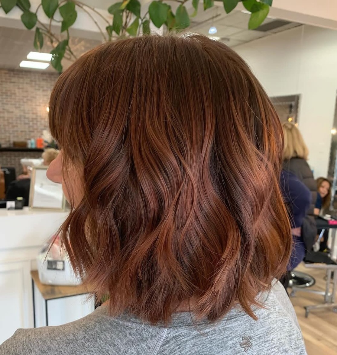 spicy summer auburn hair color 2026 Textured Auburn Bob With Lived-In Highlights