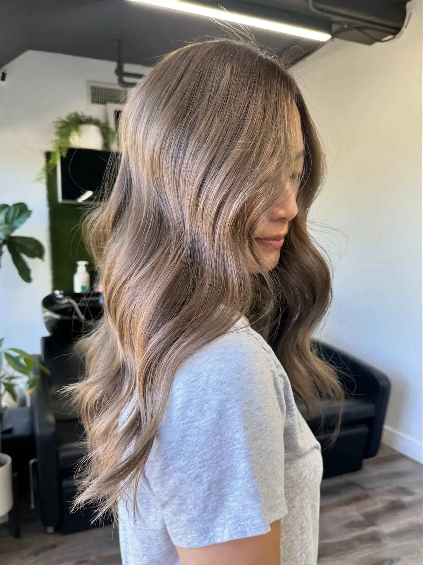 modern summer ash brown hair color 2026 Soft Ash Brown Waves With Seamless Dimension