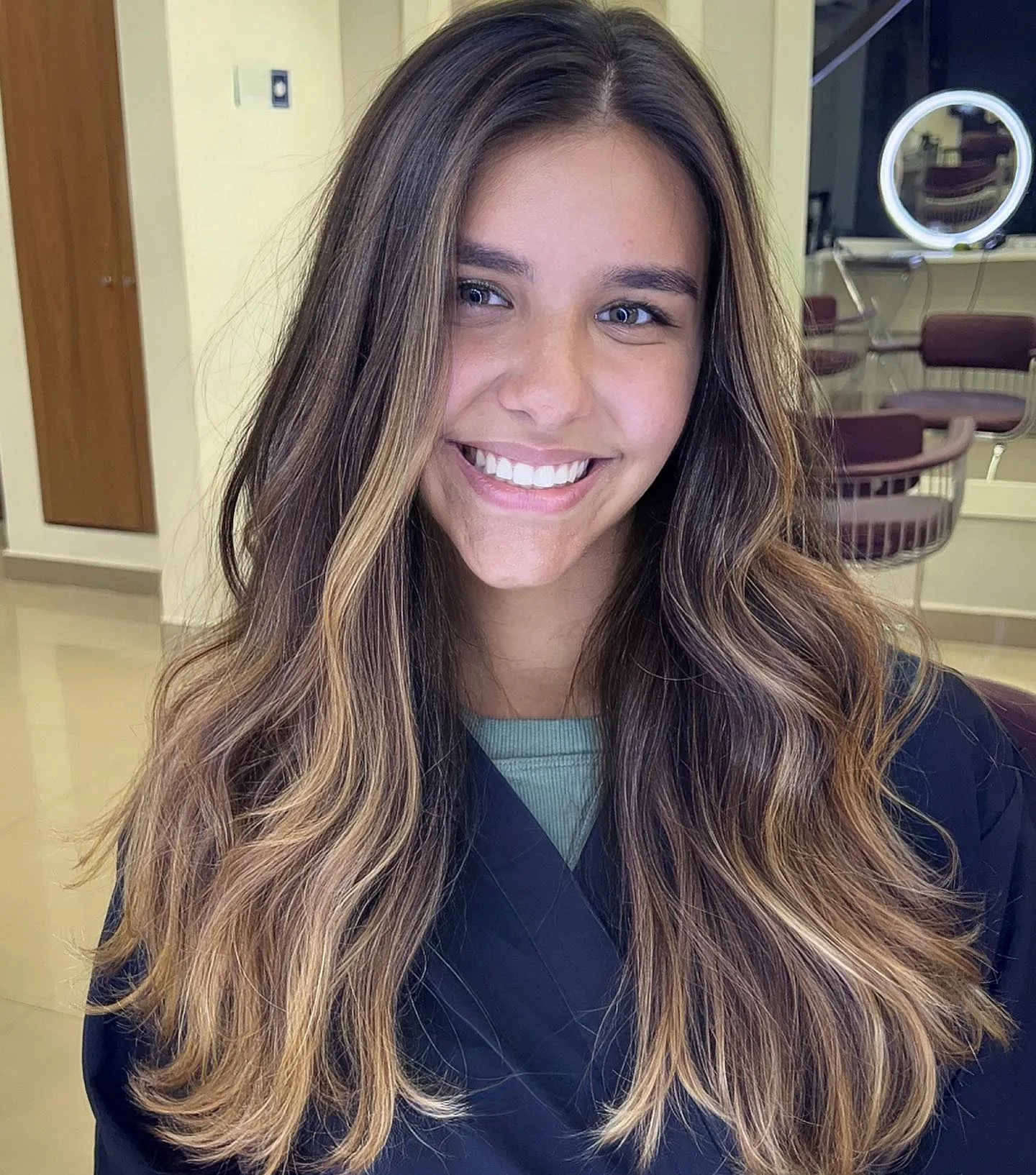 beachy summer hair color for tan skin 2026 Soft Face Framing Blonde Layers On Long Brunette Hair