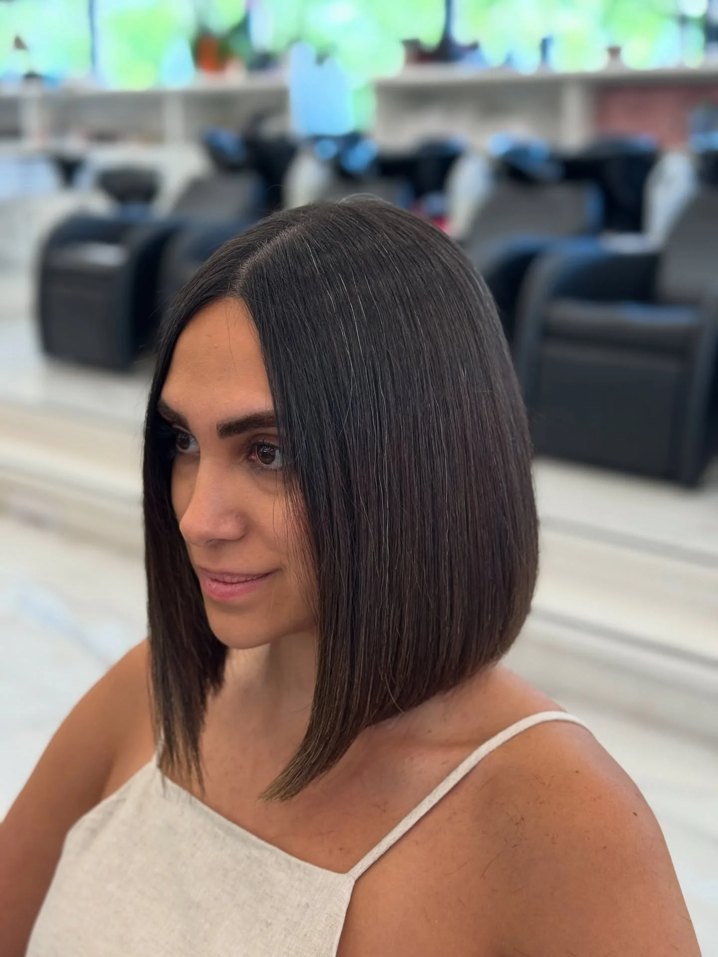 sleek summer collarbone cut 2026 Soft Angled Bob With Subtle Face Framing