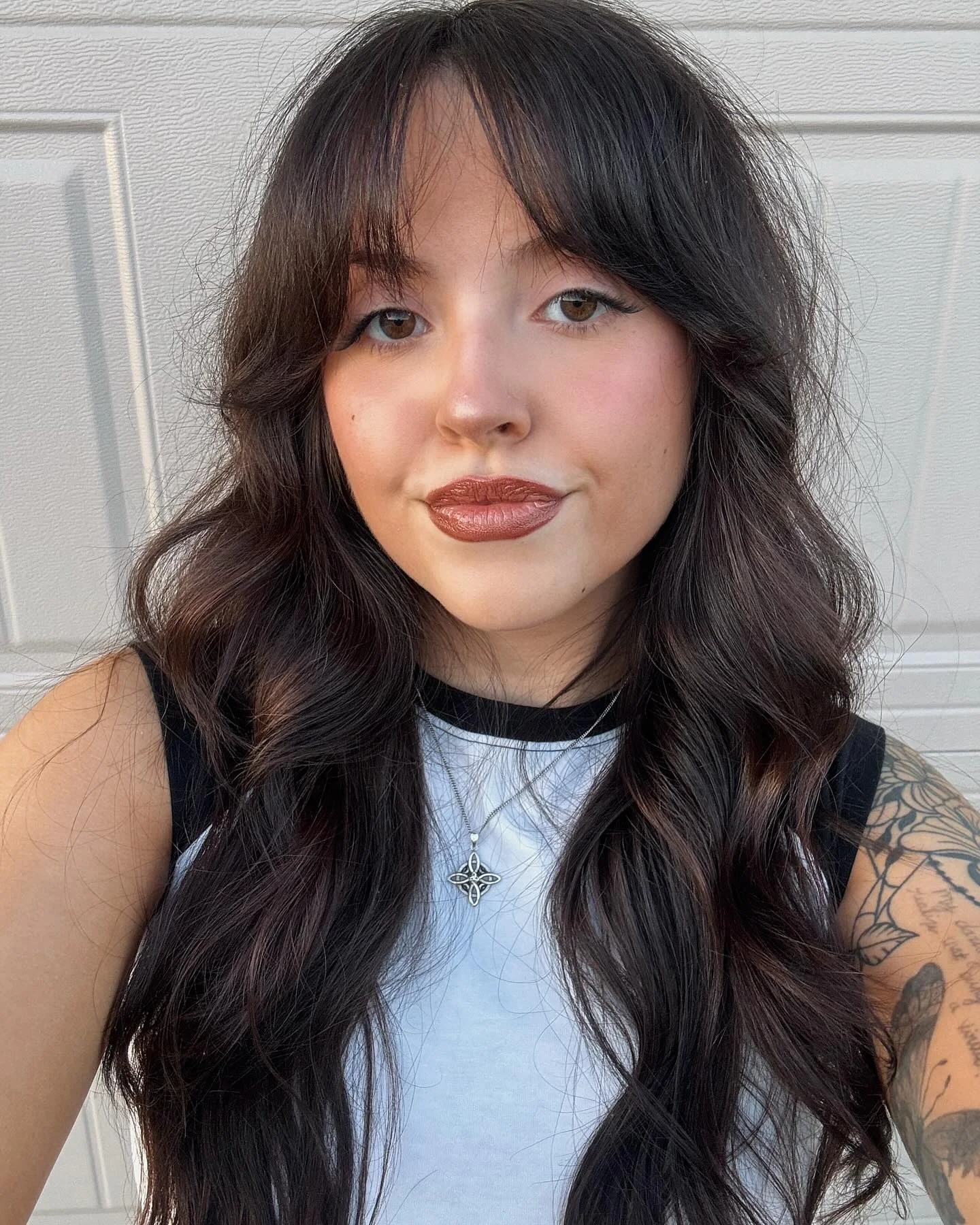 airy summer haircuts with bangs 2026 Long Glossy Waves With Feathered Bangs