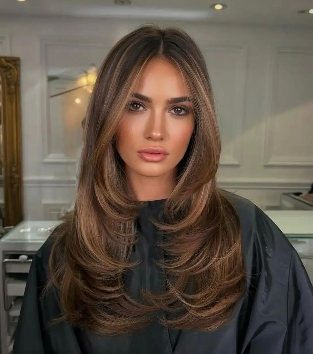 summer hair color ideas 2026 Layered Chestnut Blowout With Face Framing Light