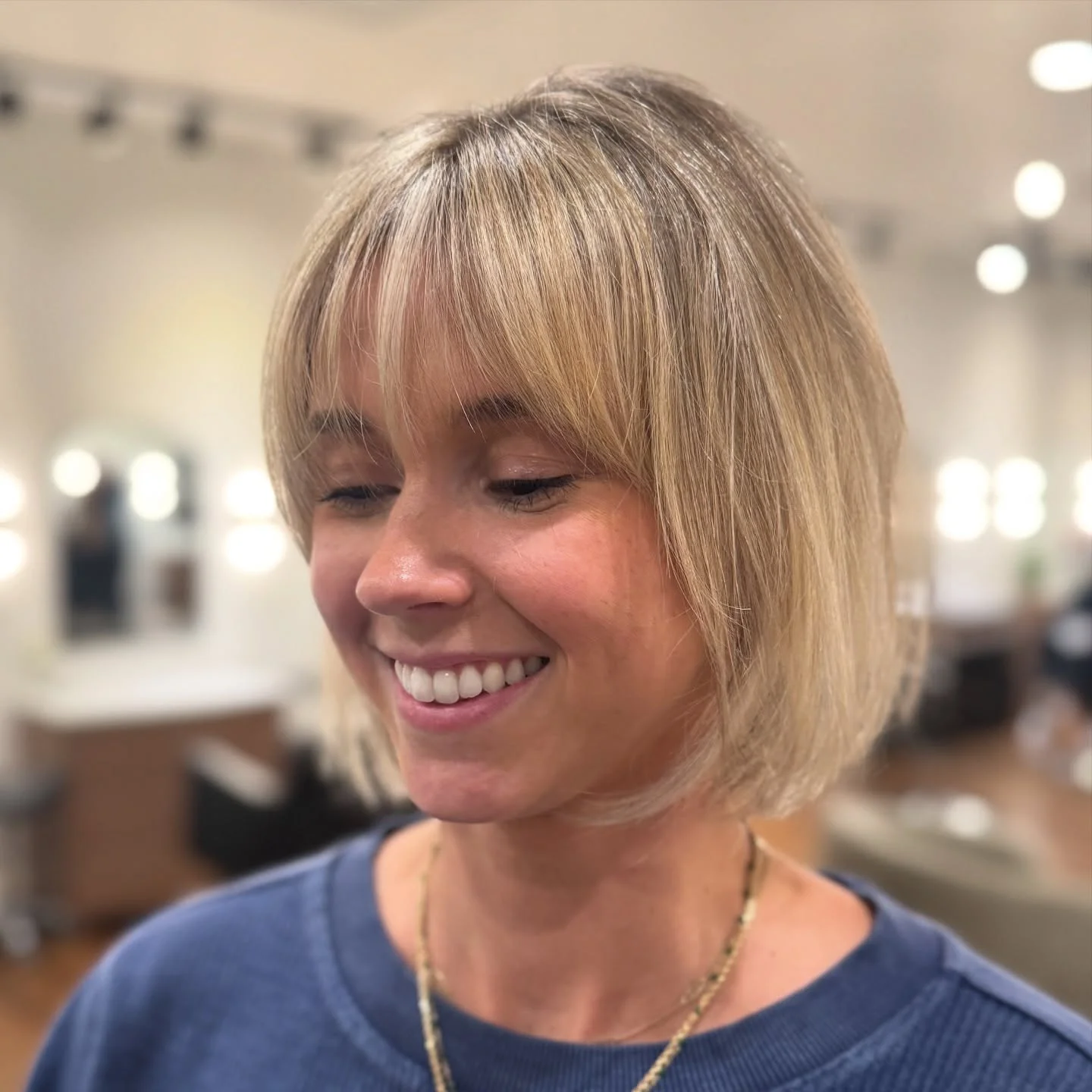 airy summer haircuts with bangs 2026 Short Blunt Bob With Light Curtain Fringe