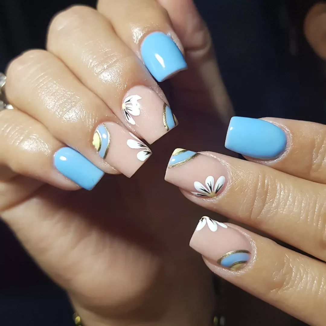 light blue summer nails Powder Blue Daisy Nails With Soft Gold Details