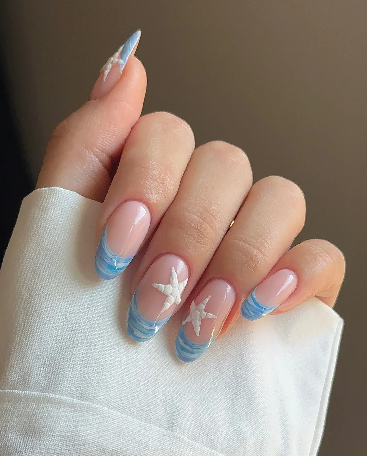 light summer nails 2026 Ocean Glass French Tips With Starfish Details