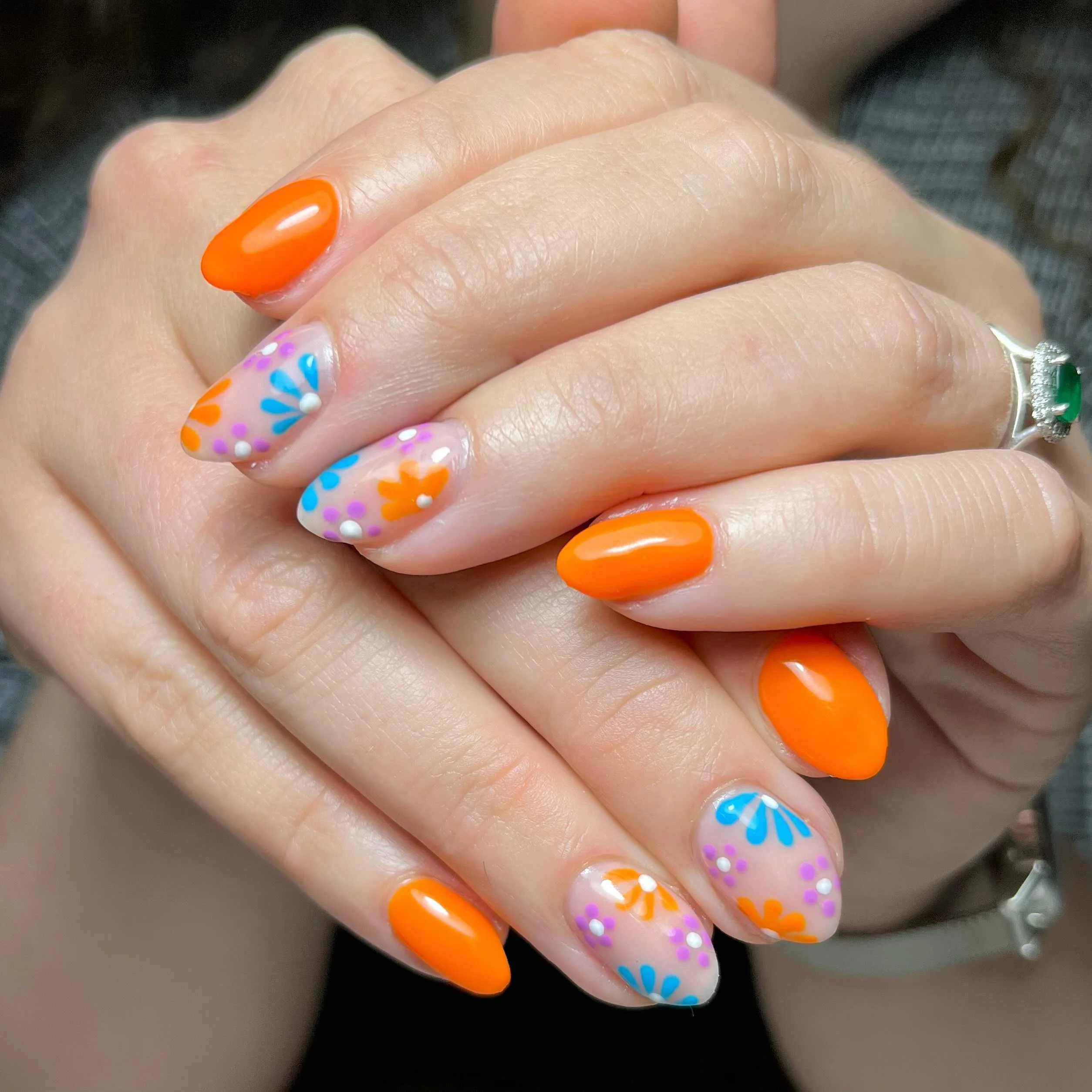 bright summer nails 2026 Bold Orange Florals That Capture Sunset Energy