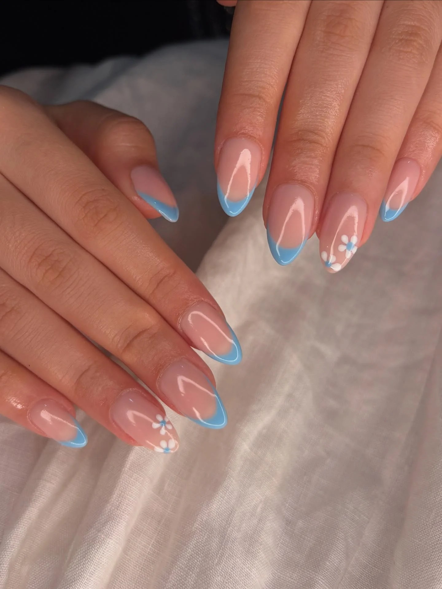 summer beach nails 2026 Minimal Blue French Tips With Delicate Daisy Art