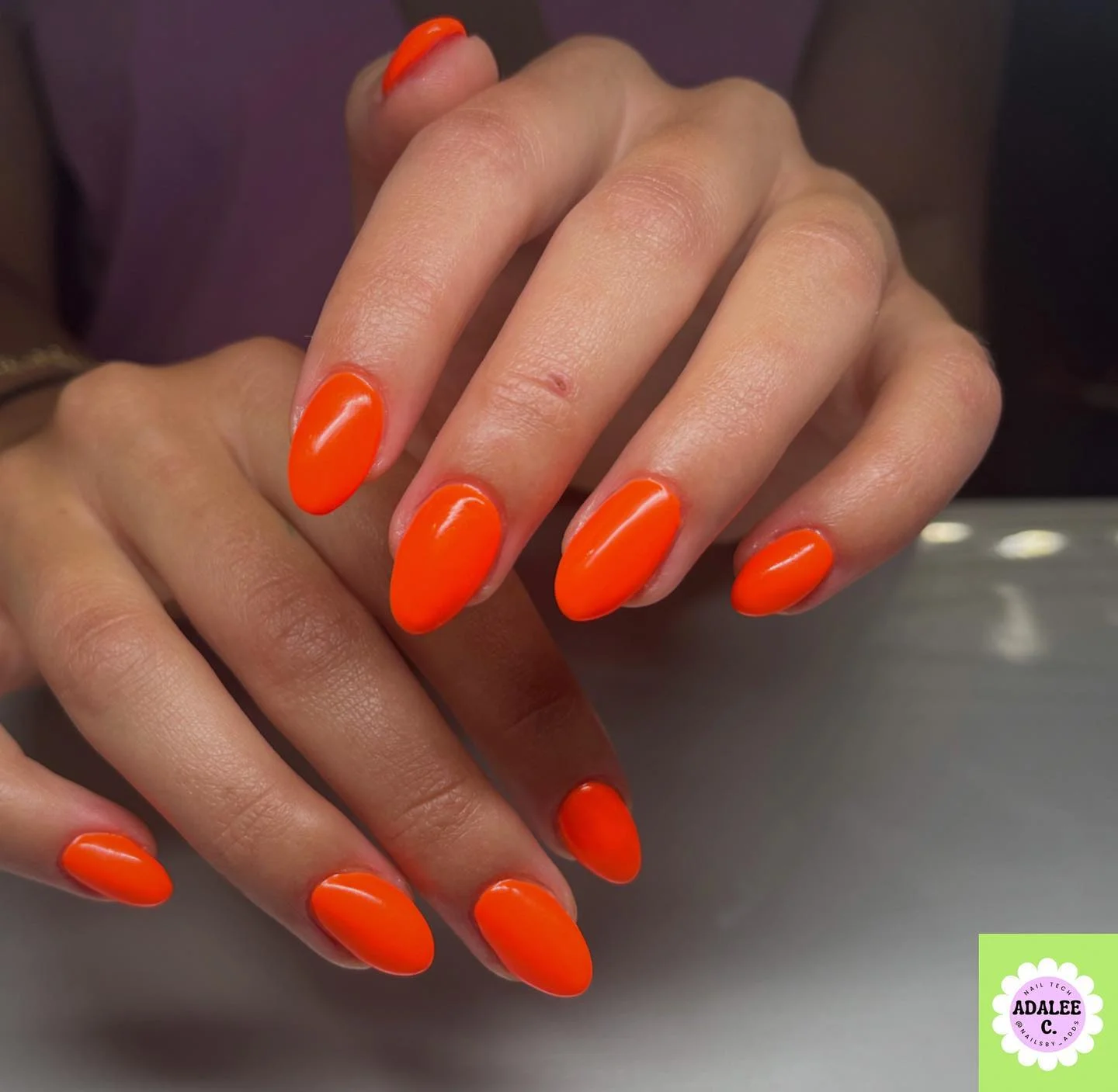 summer nail colors 2026 Neon Orange Nails That Practically Glow At Sunset