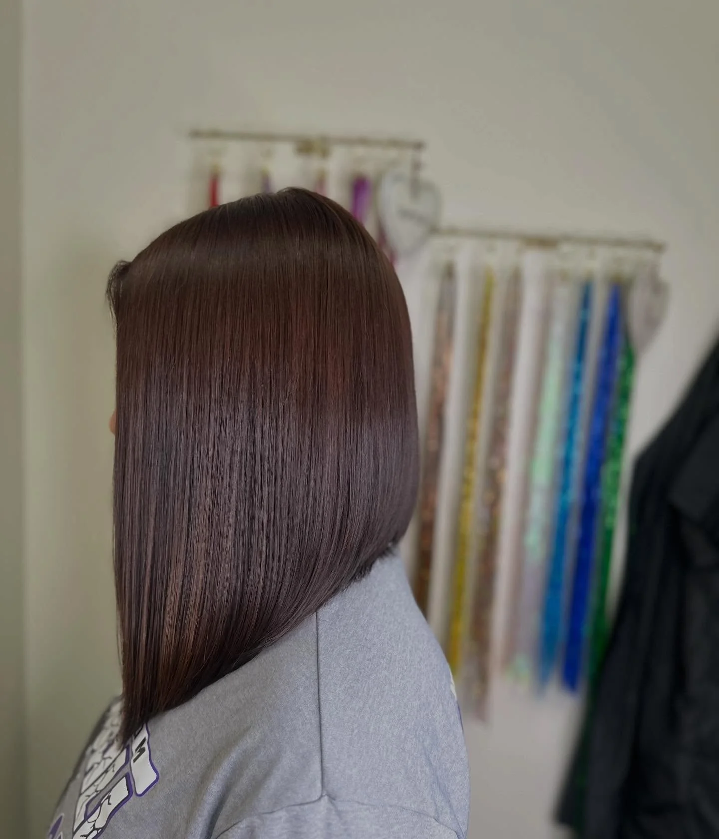 angled summer bob haircut 2026 Glass Smooth Angled Lines With Mirror Shine