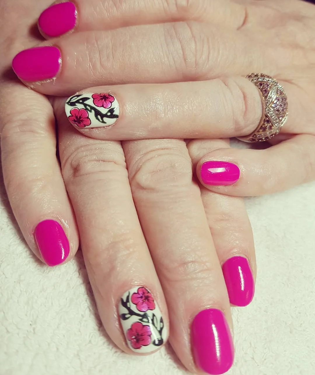 pink summer nails 2026 Hot Pink Blossom Nails With Graphic Floral Art