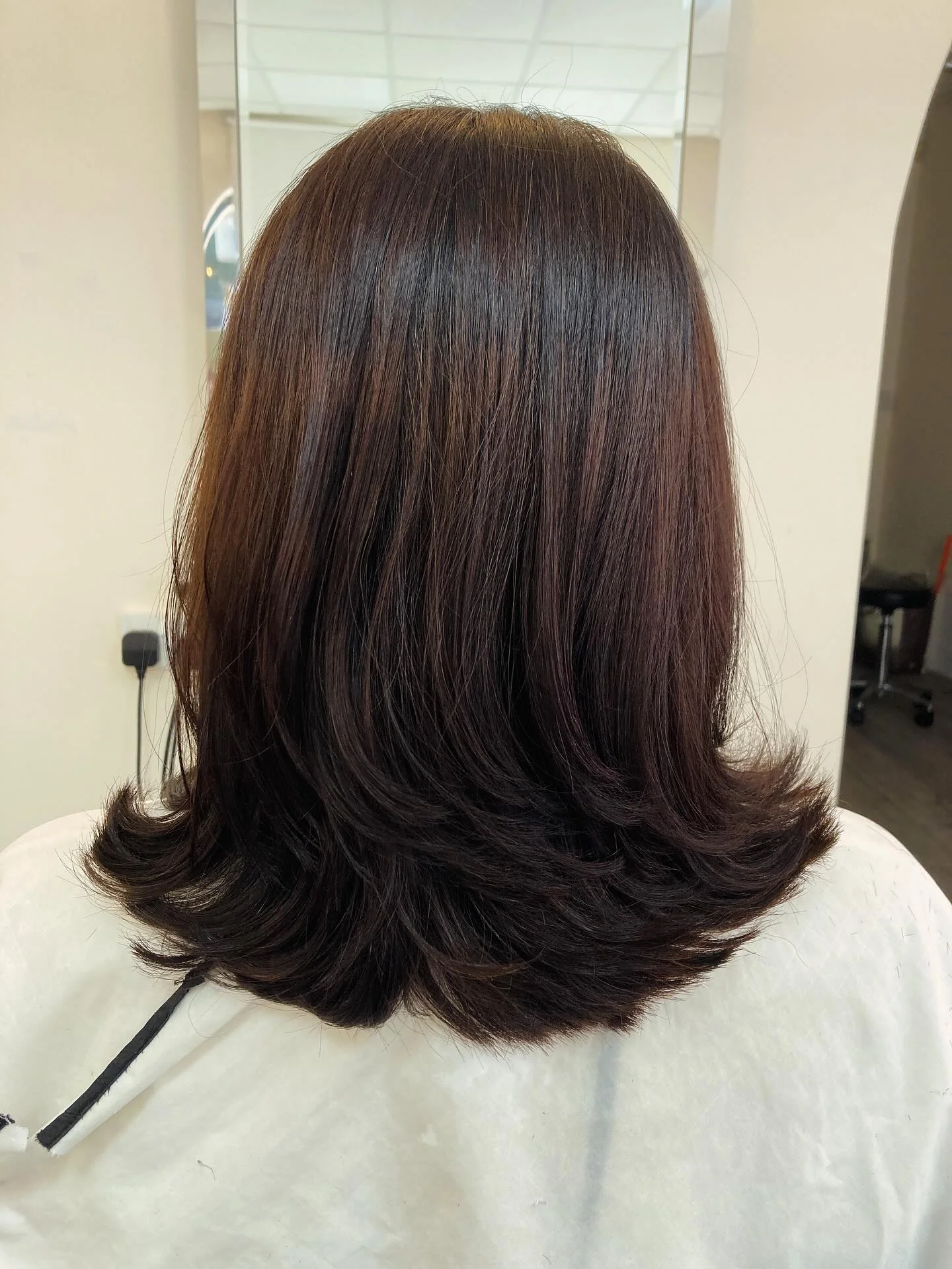 summer haircuts women over 50 Soft Layered Flip Medium Cut With Polished Ends