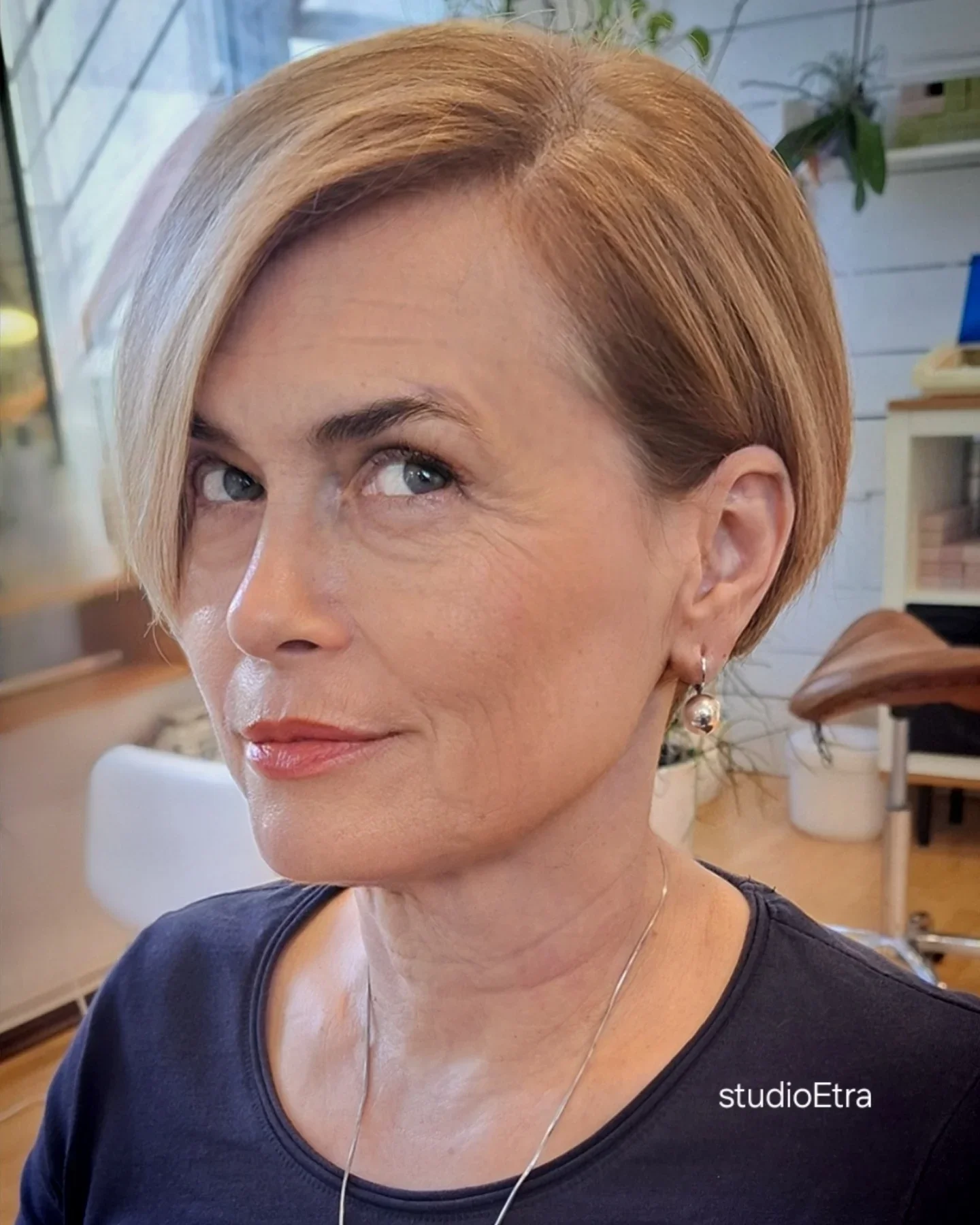 summer haircuts women over 50 Sleek Side Part Short Bob With Sculpted Volume