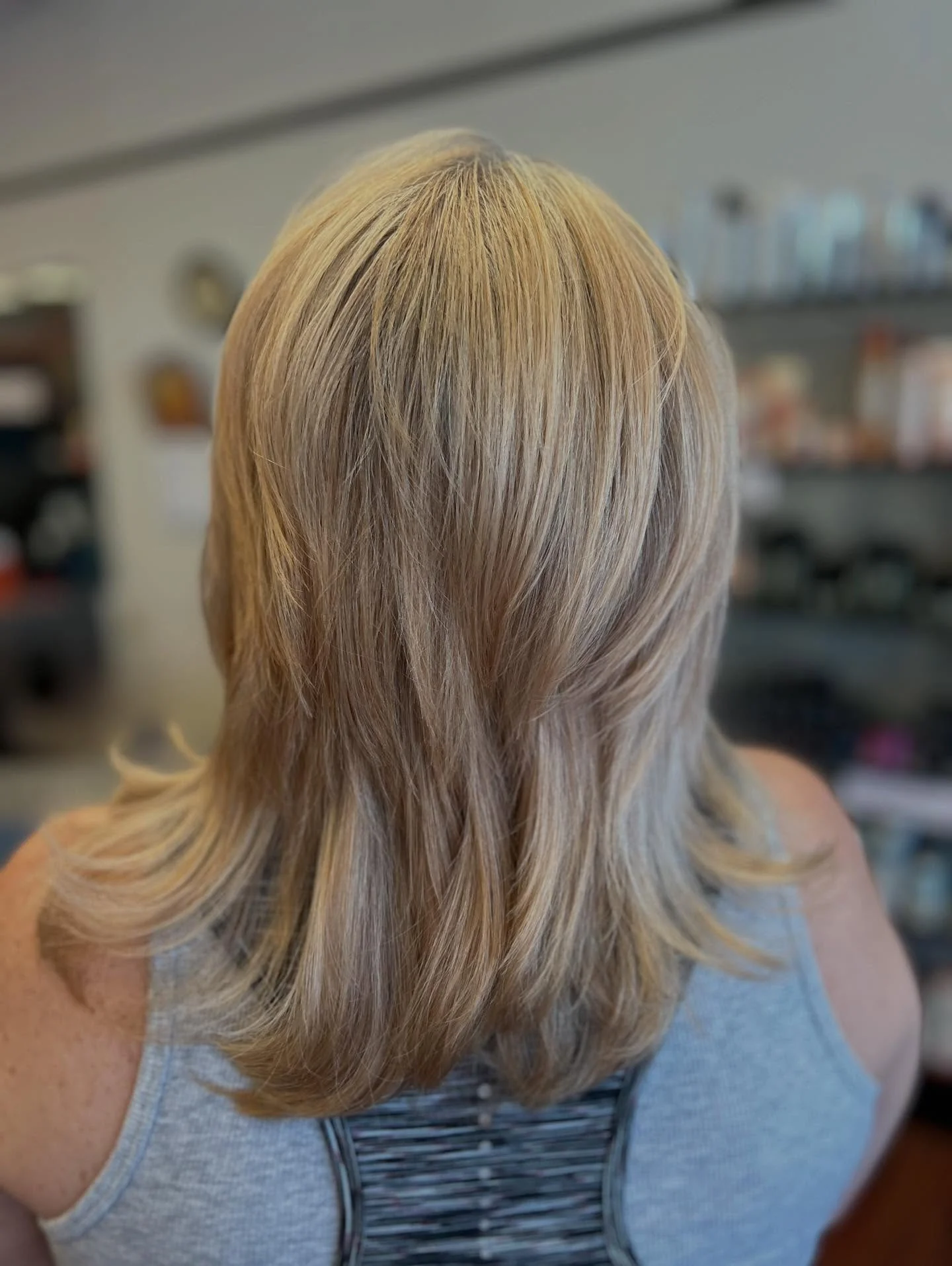 stylish summer haircuts for women over 60 2026 Feathered Long Layers With Soft Summer Blonde