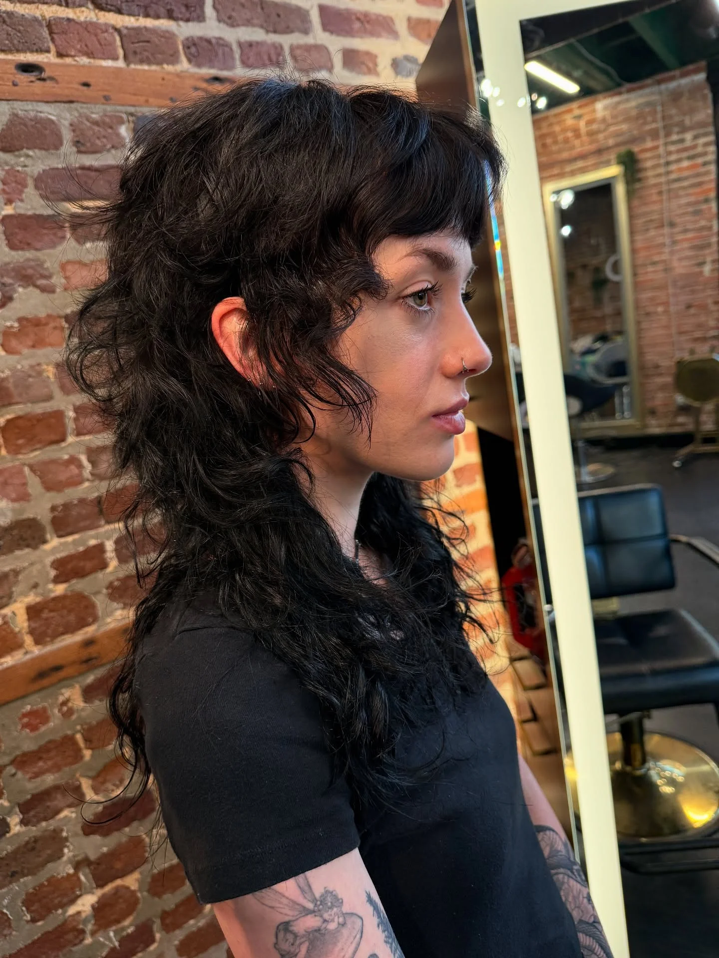 edgy summer shag hairstyle 2026 Rockstar Raven Shag With Choppy Curly Layers
