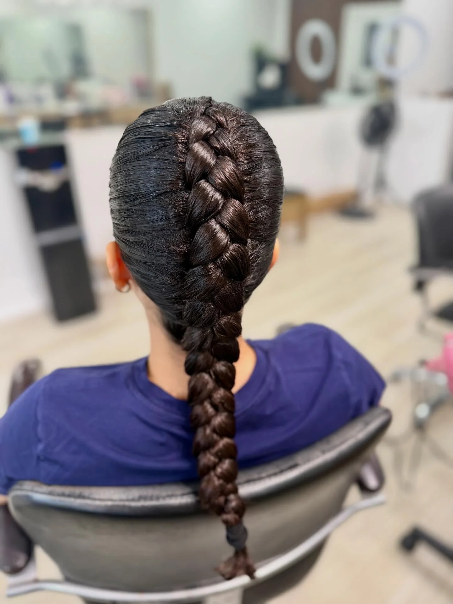 natural summer braids hairstyle 2026 Glossy Center Braid With Sleek Sculpted Finish
