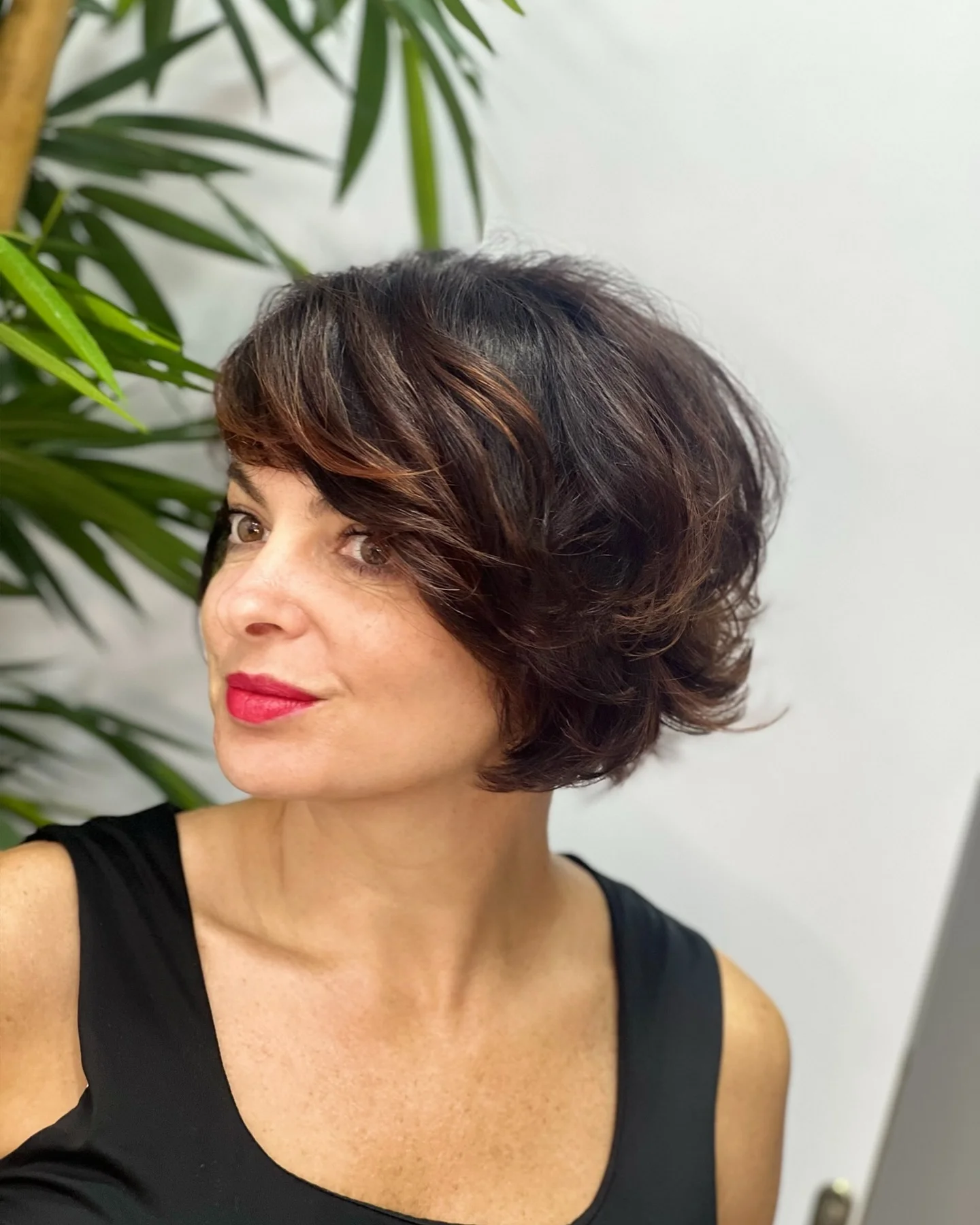 sophisticated summer haircuts for women over 40 2026 Elegant Short Voluminous Bob With Side Sweep