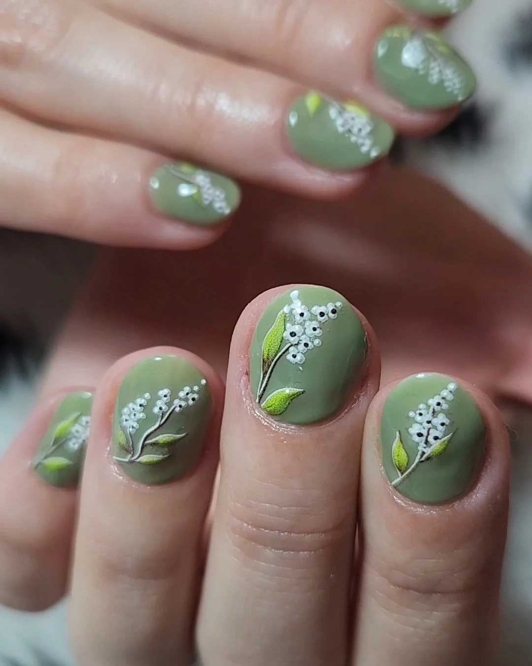 summer flower nails 2026 Muted Green Botanical Nails With Lily Of The Valley Details