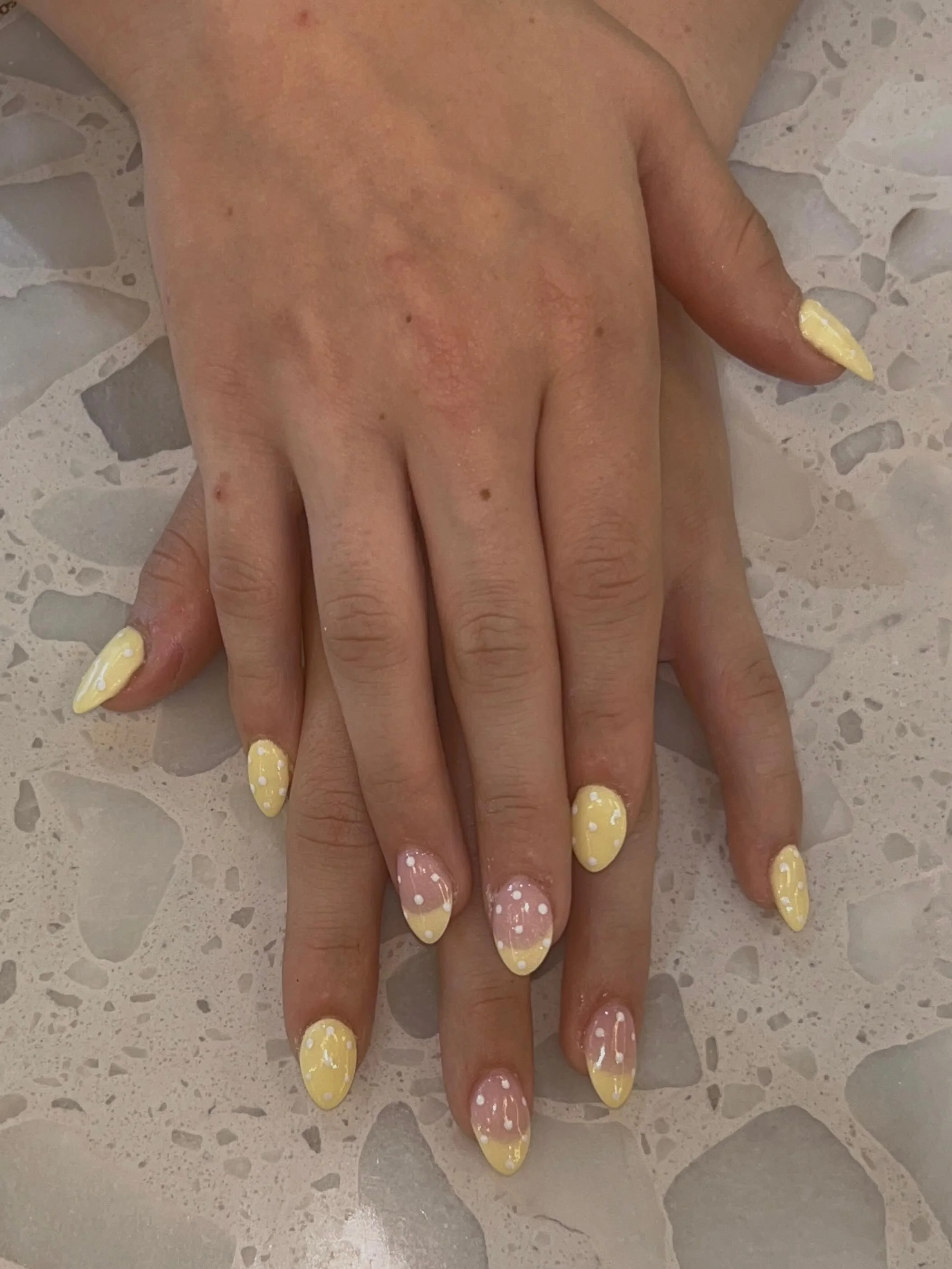light summer nails 2026 Butter Yellow Almond Nails With Soft Polka Dots